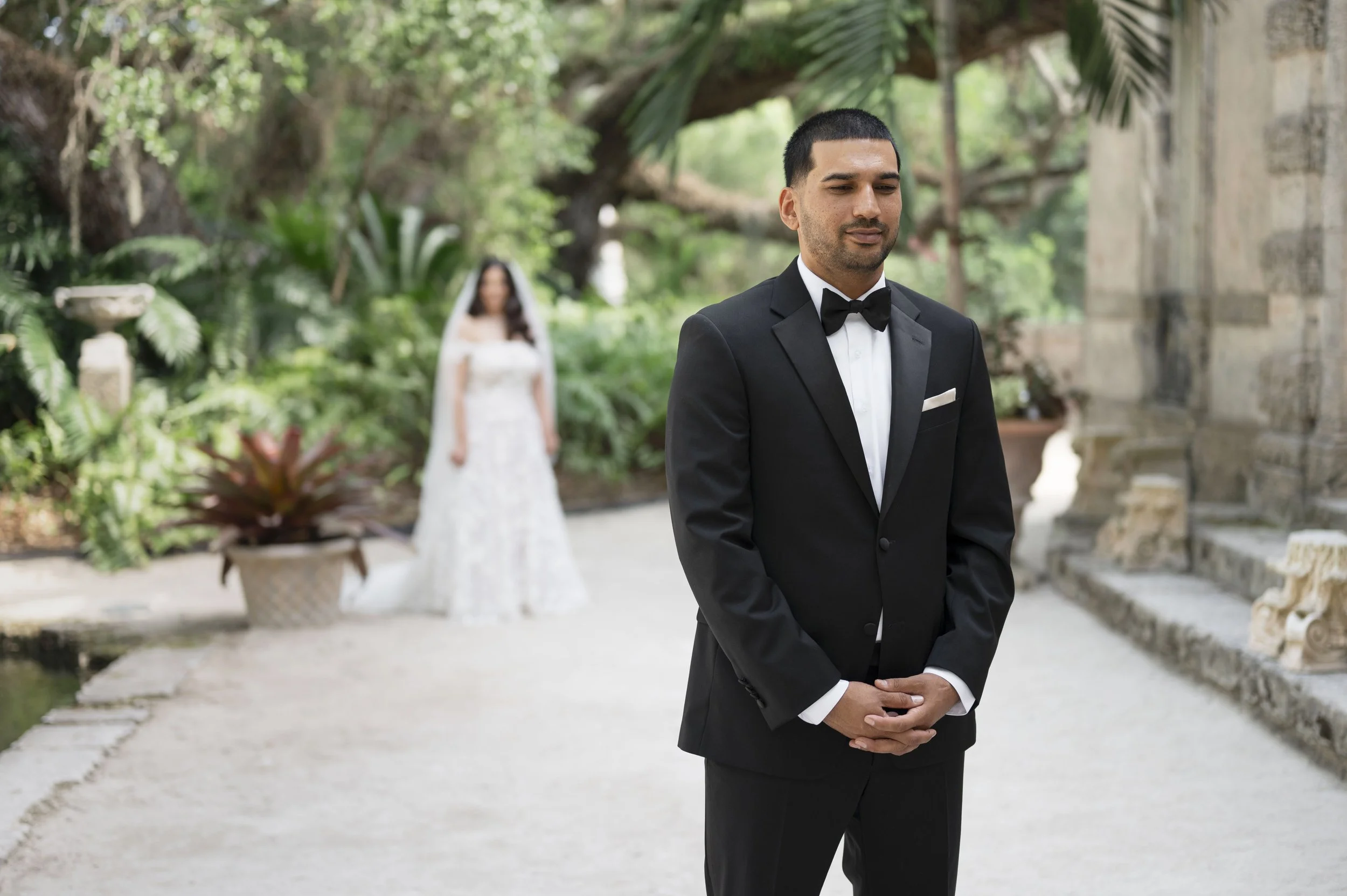 Groom standing waiting for their firs look by the mount at the Vizcaya museum