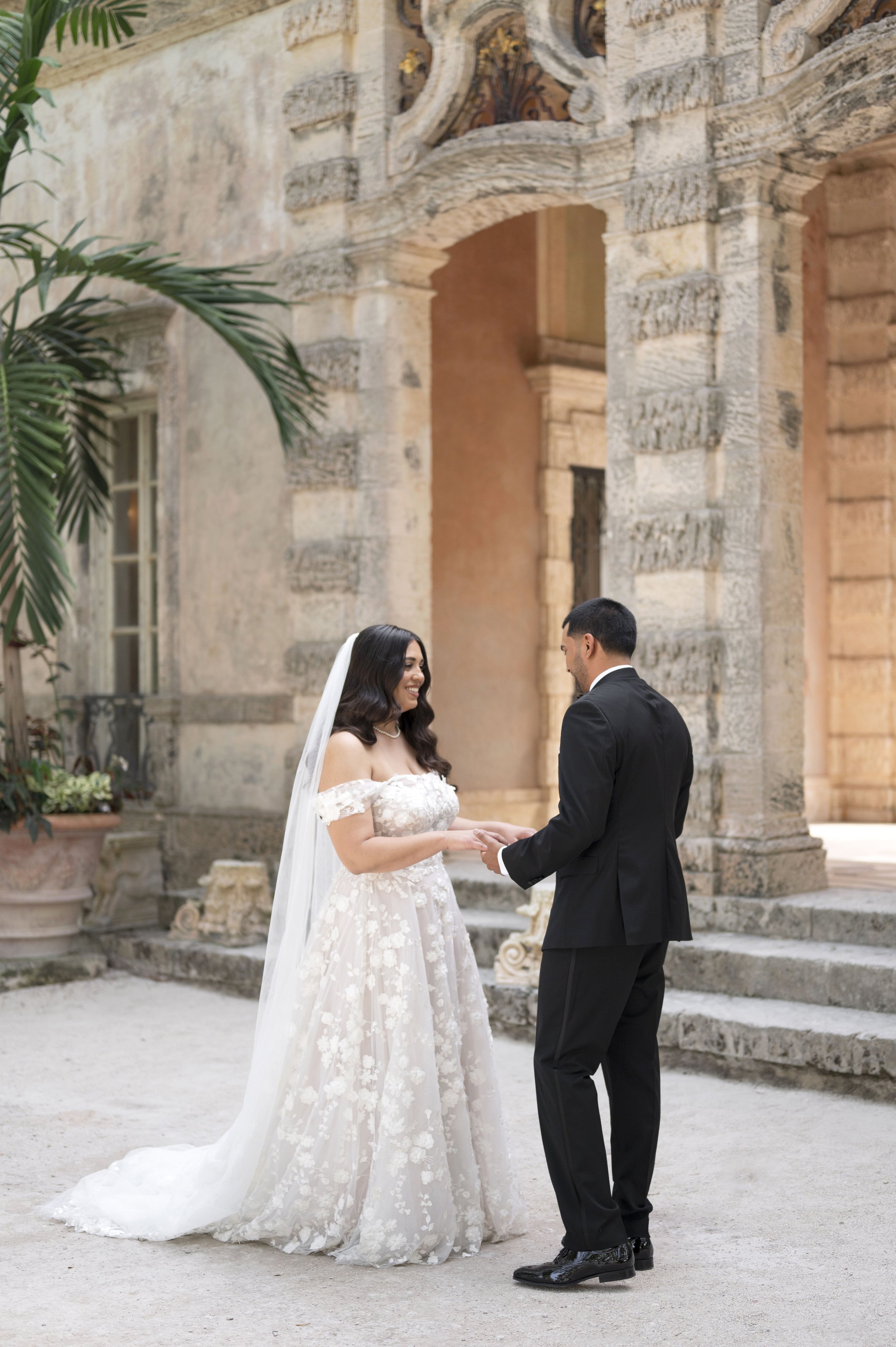 bride and groom first look at the Vizcaya museum on their wedding day