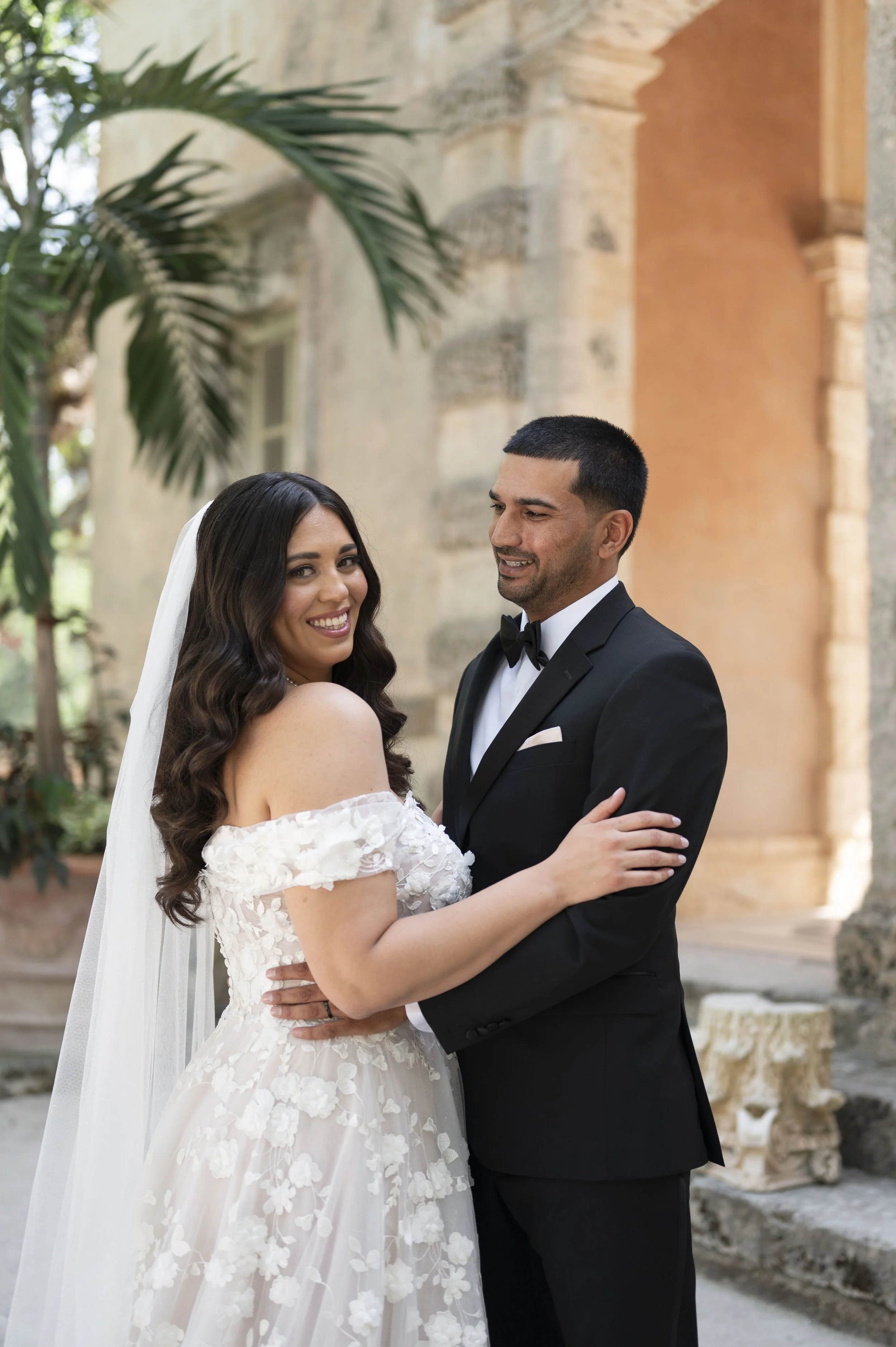 Christina and Saby looking at each other at the Vizcaya museum on their wedding day