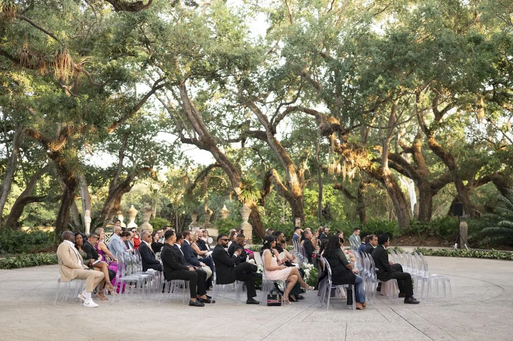 guests sitting in a ceremony hosted at the vizcaya museum wedding in miami