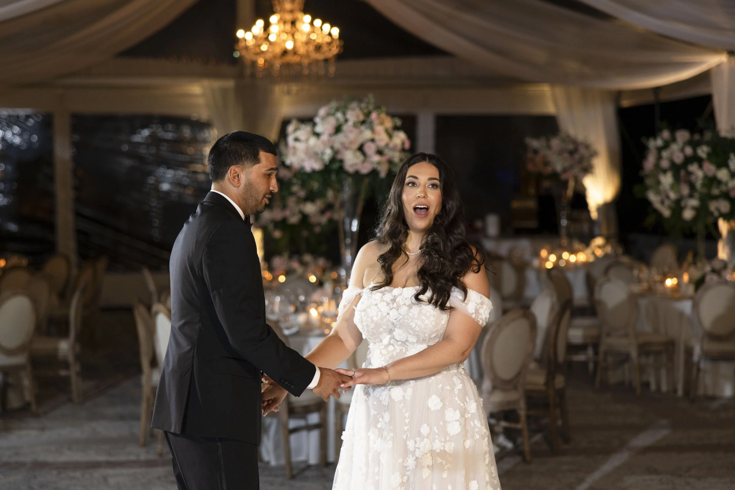 first look of the bride and groom of their reception tent at the Vizcaya museum and gardens