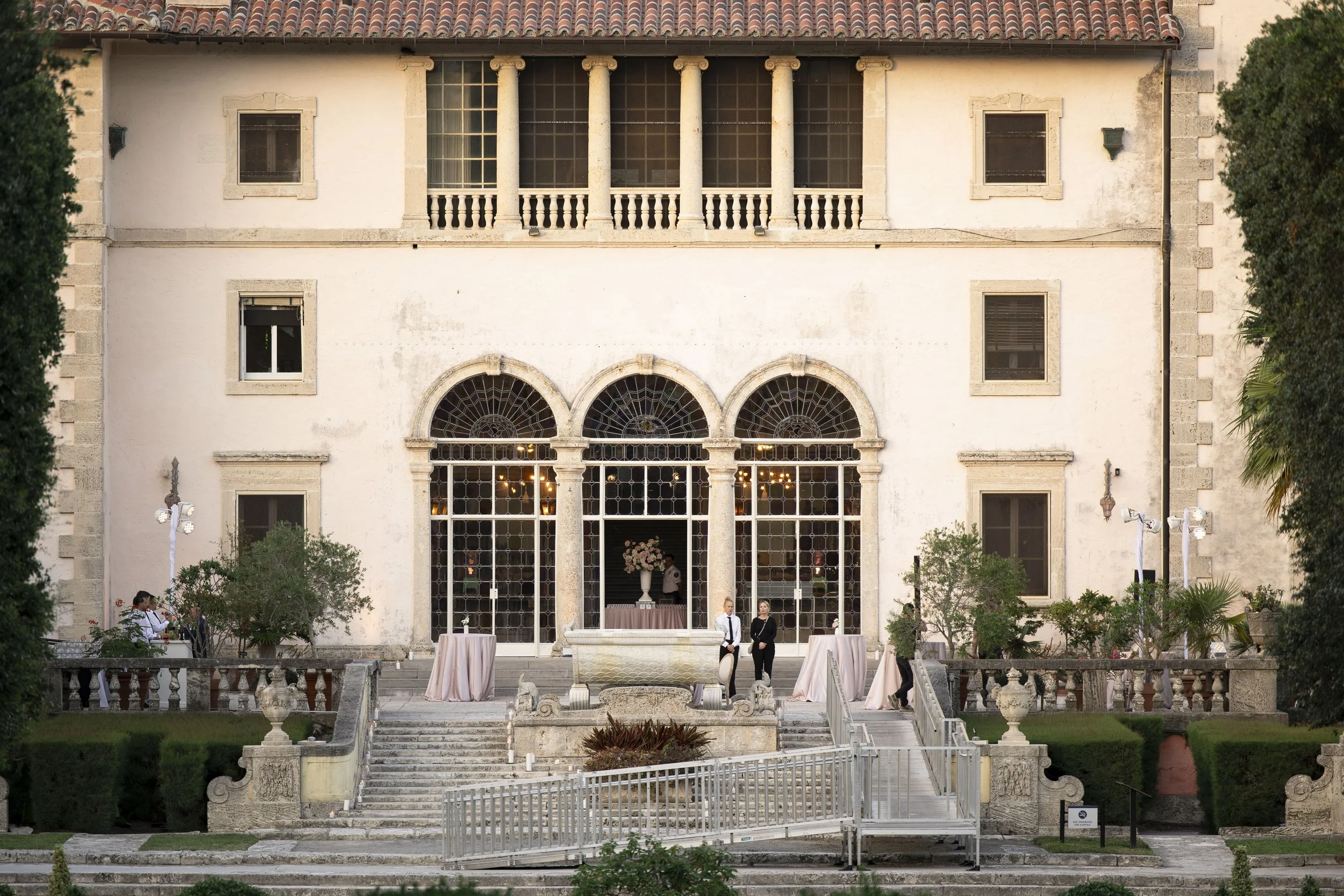 view of the vizcaya museum house at sunset time after wedding ceremony 