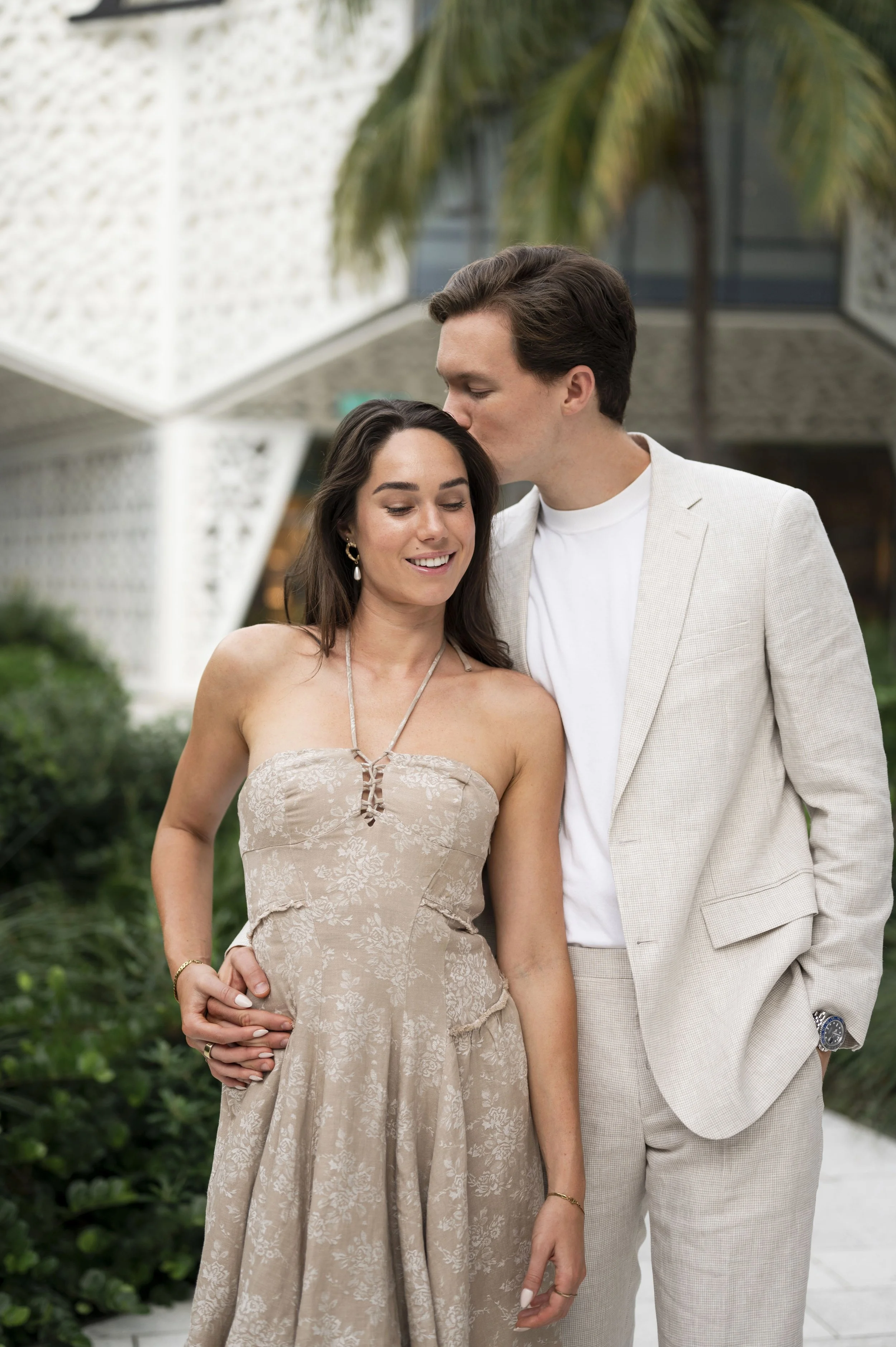 Travis kisses Rachel in the temple during a couple session in the miami design district