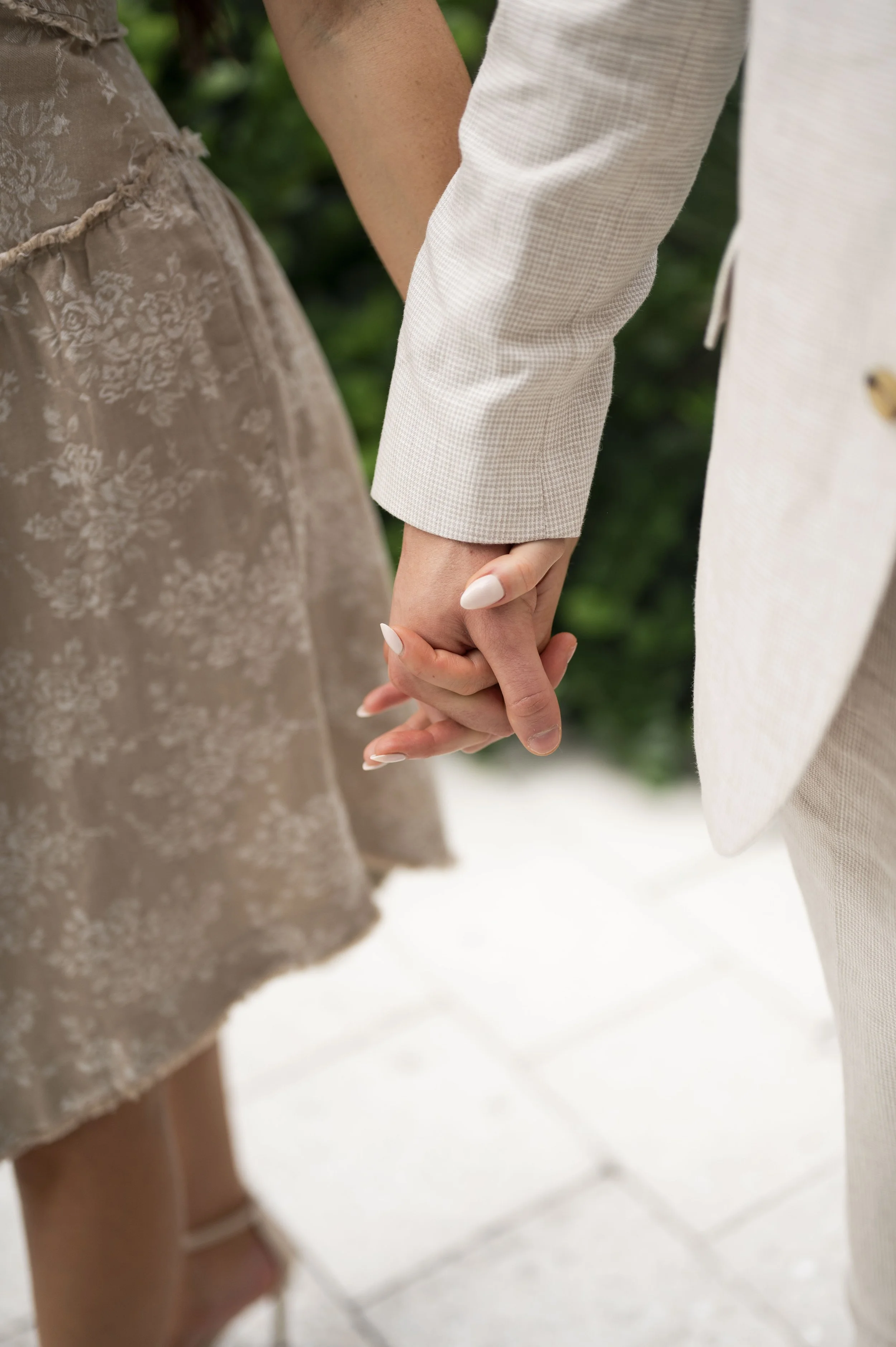 close up of rachel and travis hands during their engagement session at miami design district