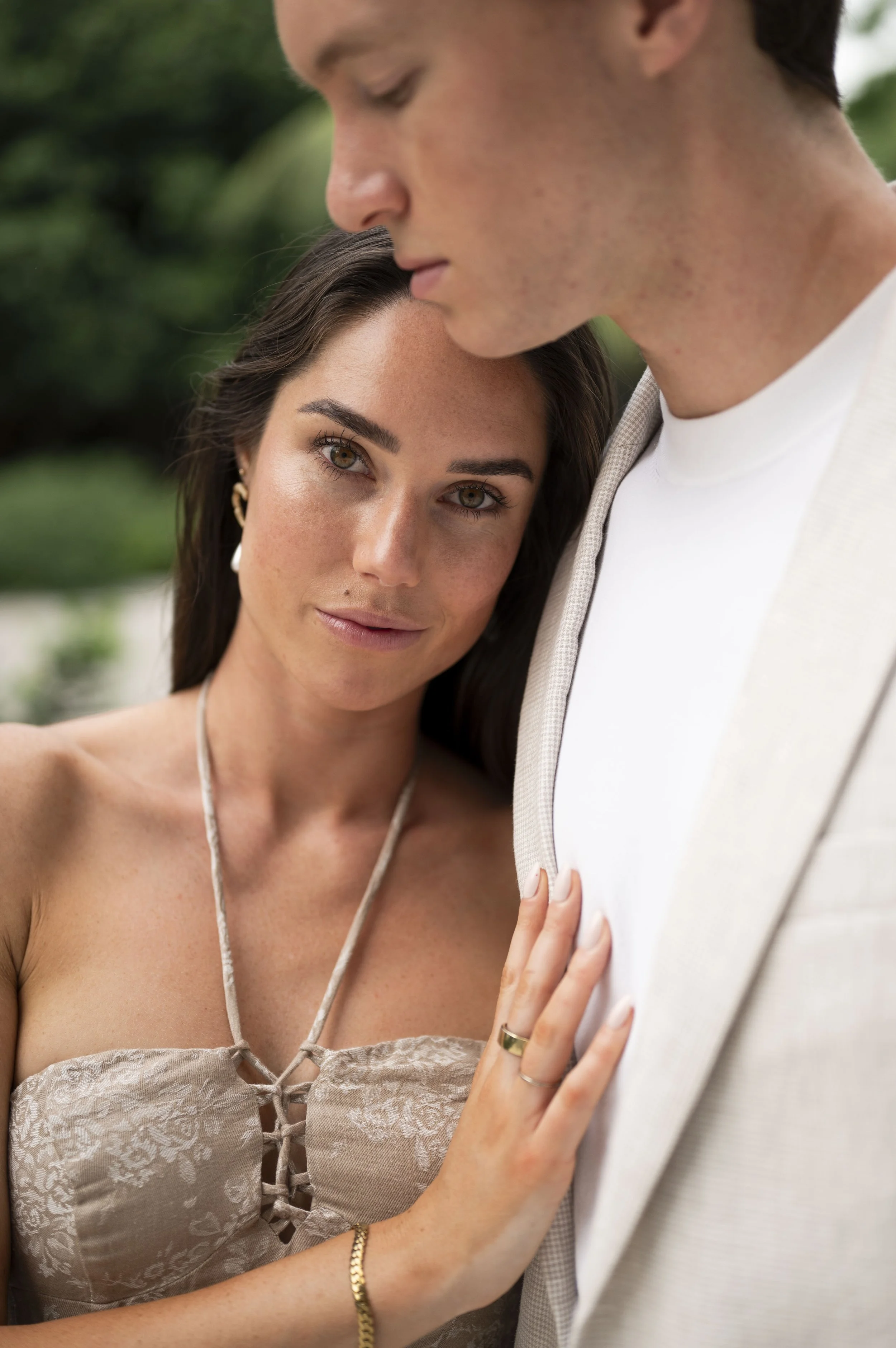Rachel leaning her head on Travis chess during their miami design district engagement session