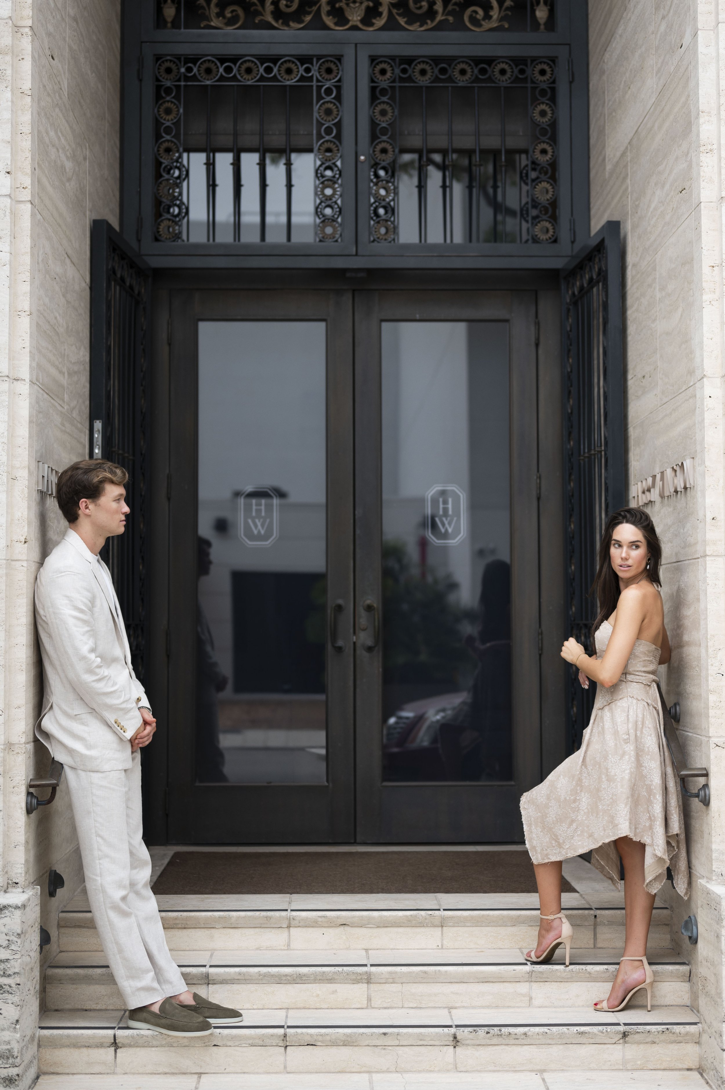 Travis and Rachel standing in front of Miami Harry Winston store during their engagement session