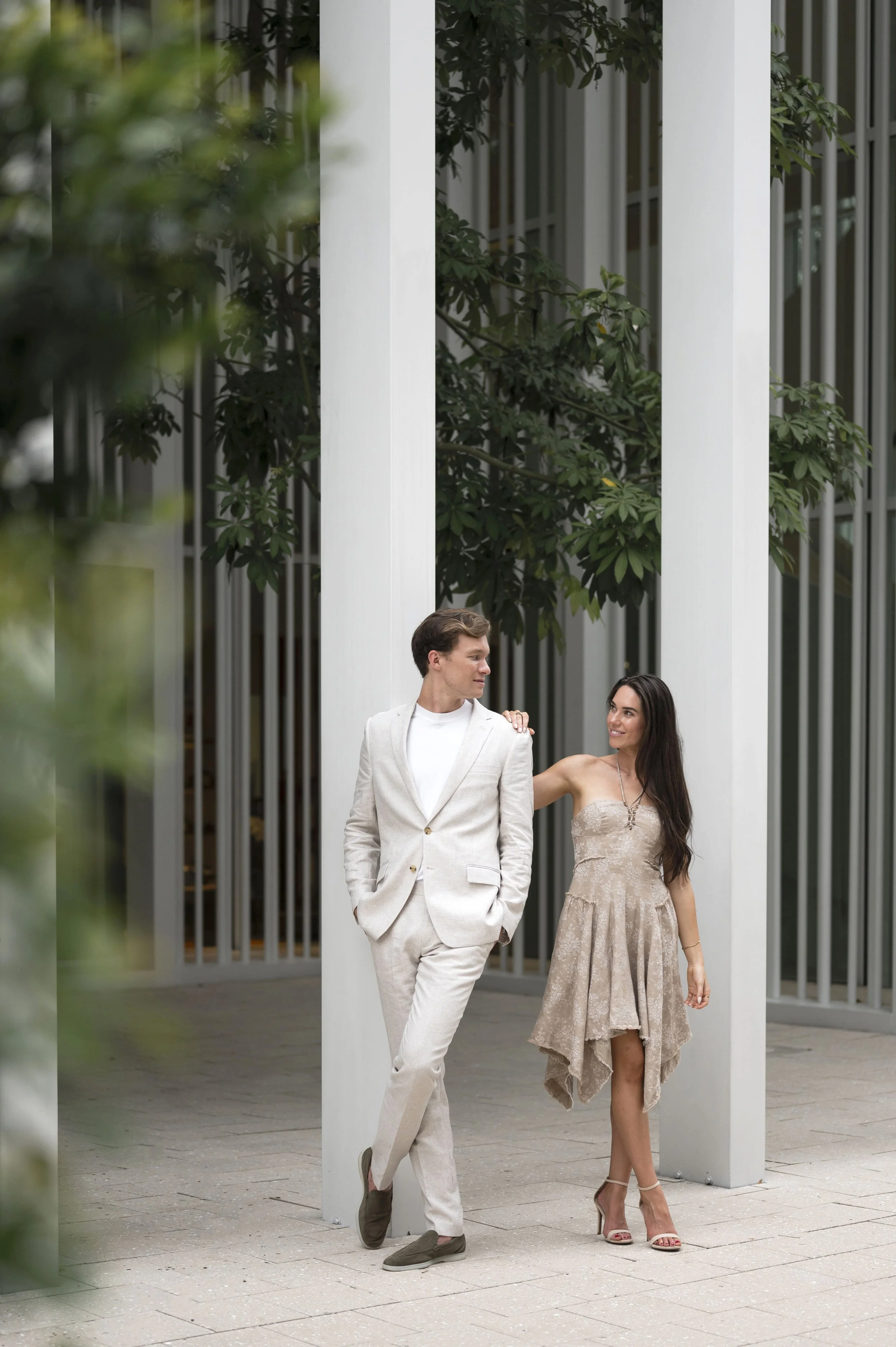 rachel leans on travis in miami design district during their engagement session