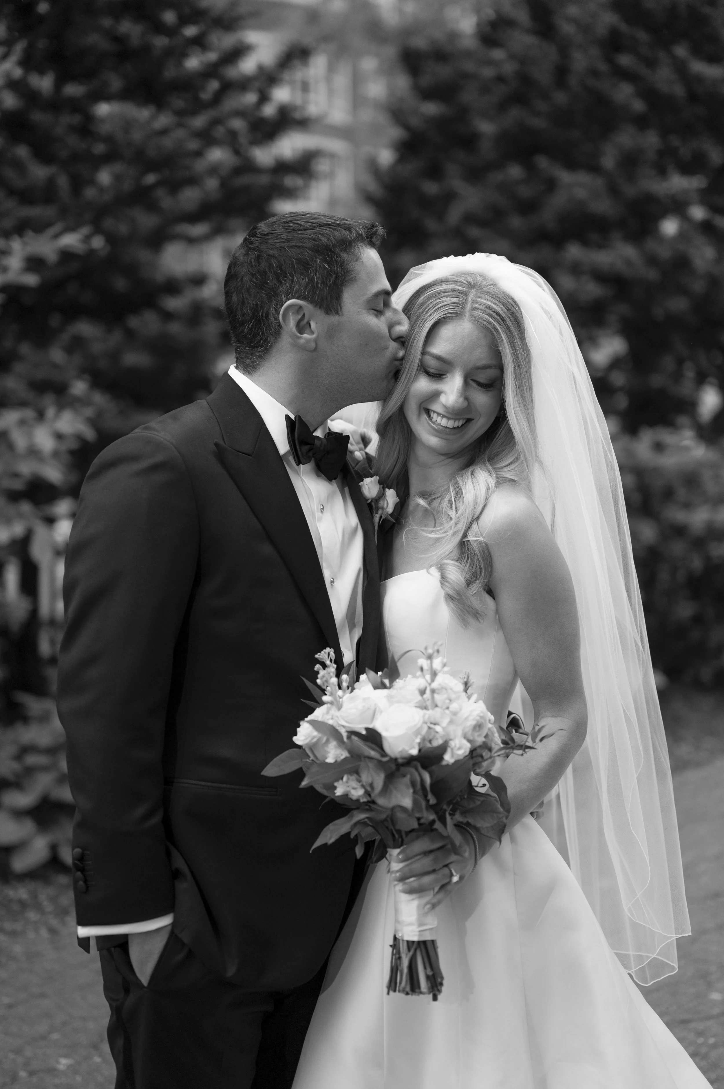 groom kisses ride as they see each other for the first time on the wedding day