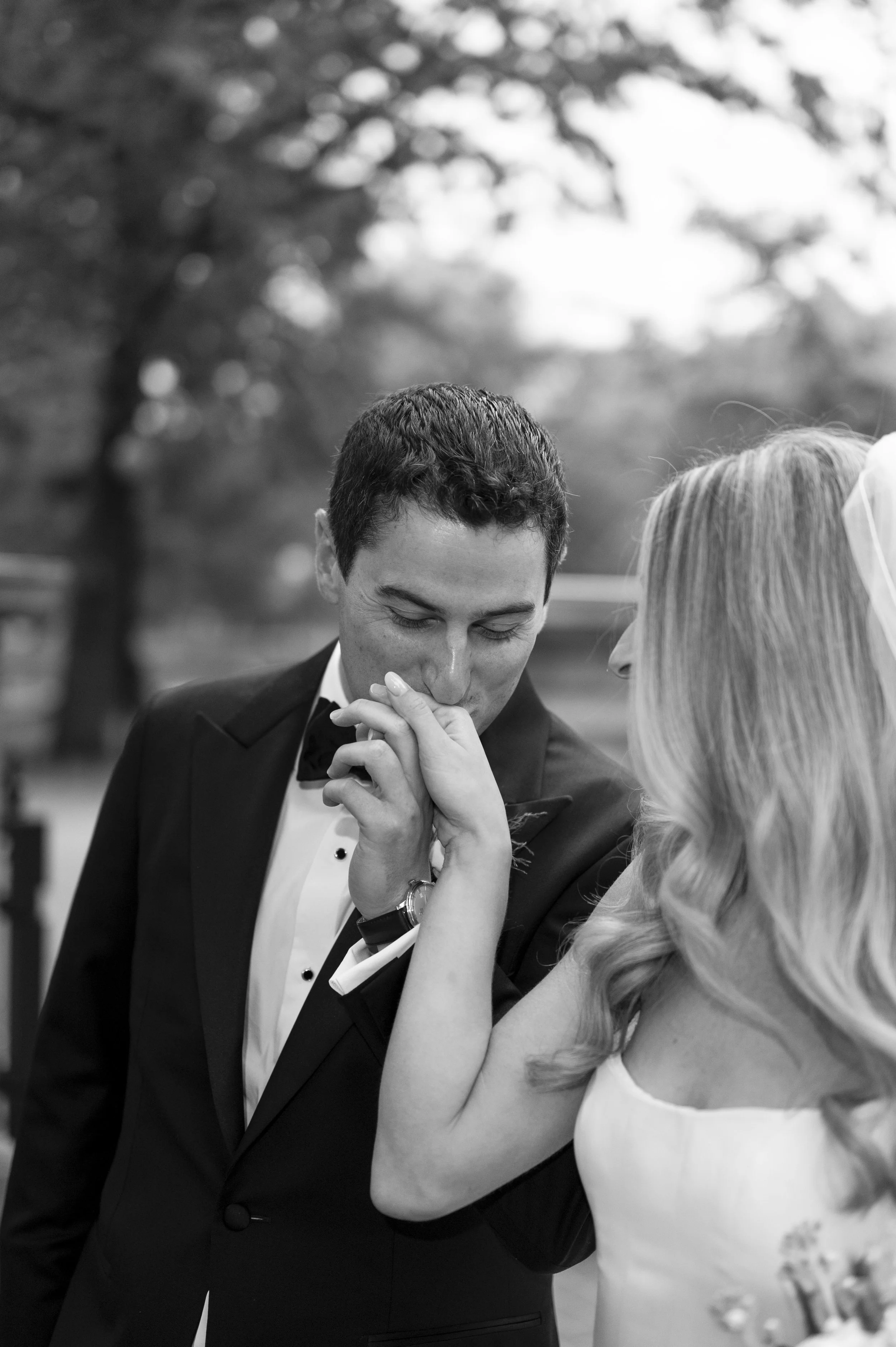 groom kisses brides hand
