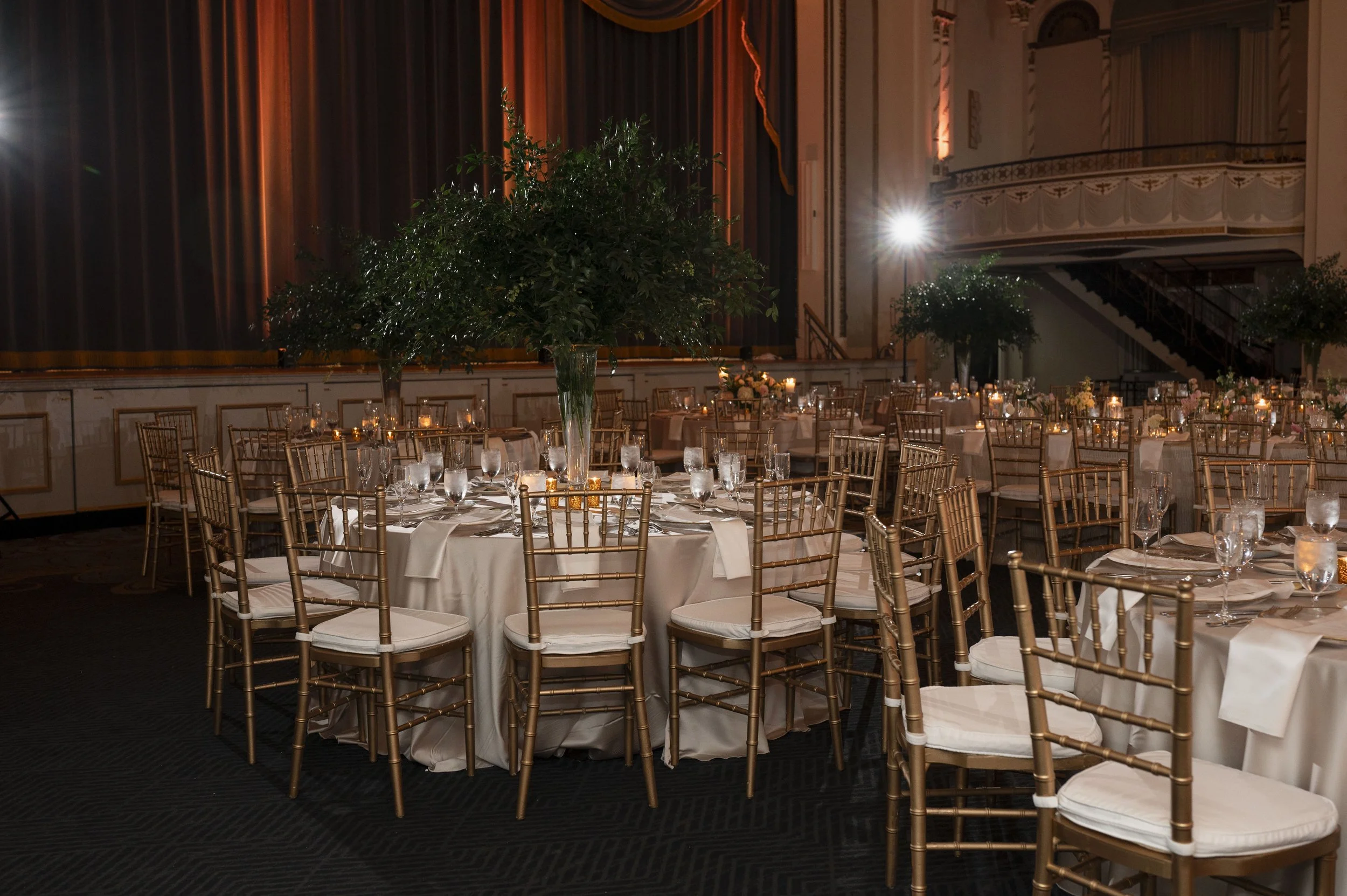 luxiry wedding reception decor at the boston park plaza featuring gold accents, candlelight and romantic florals