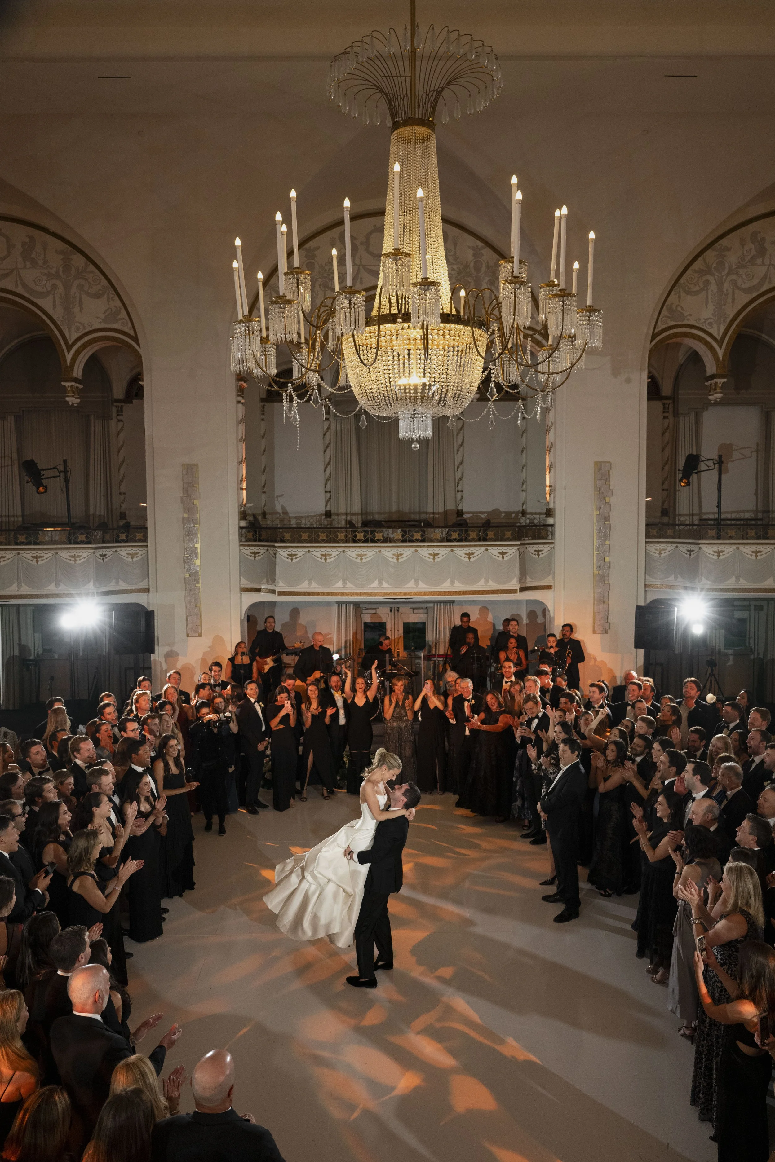 first dance of the bride and groom in the middle of the dance floor