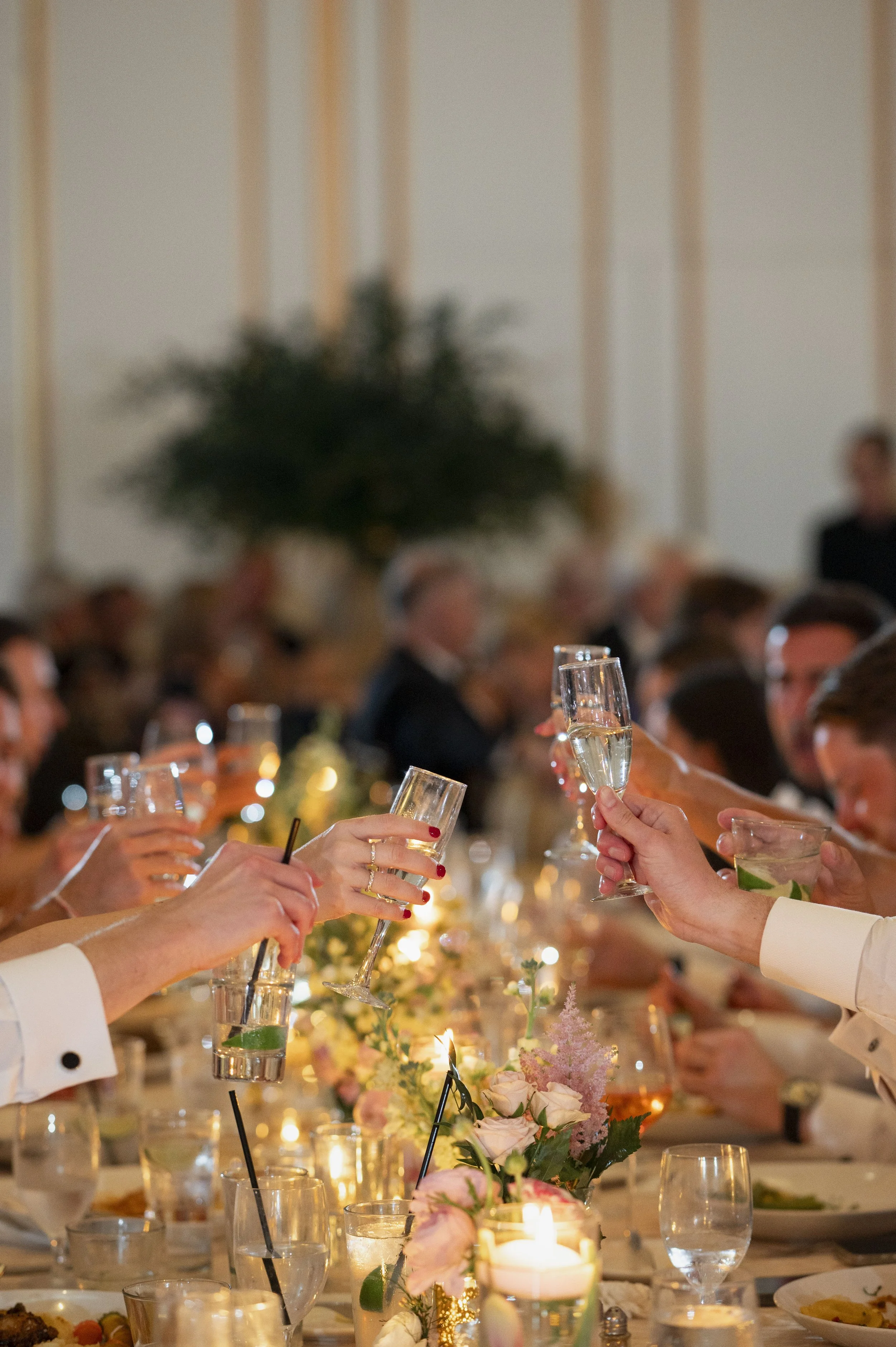 detail of guest cheering glasses during reception at the boston park plaza