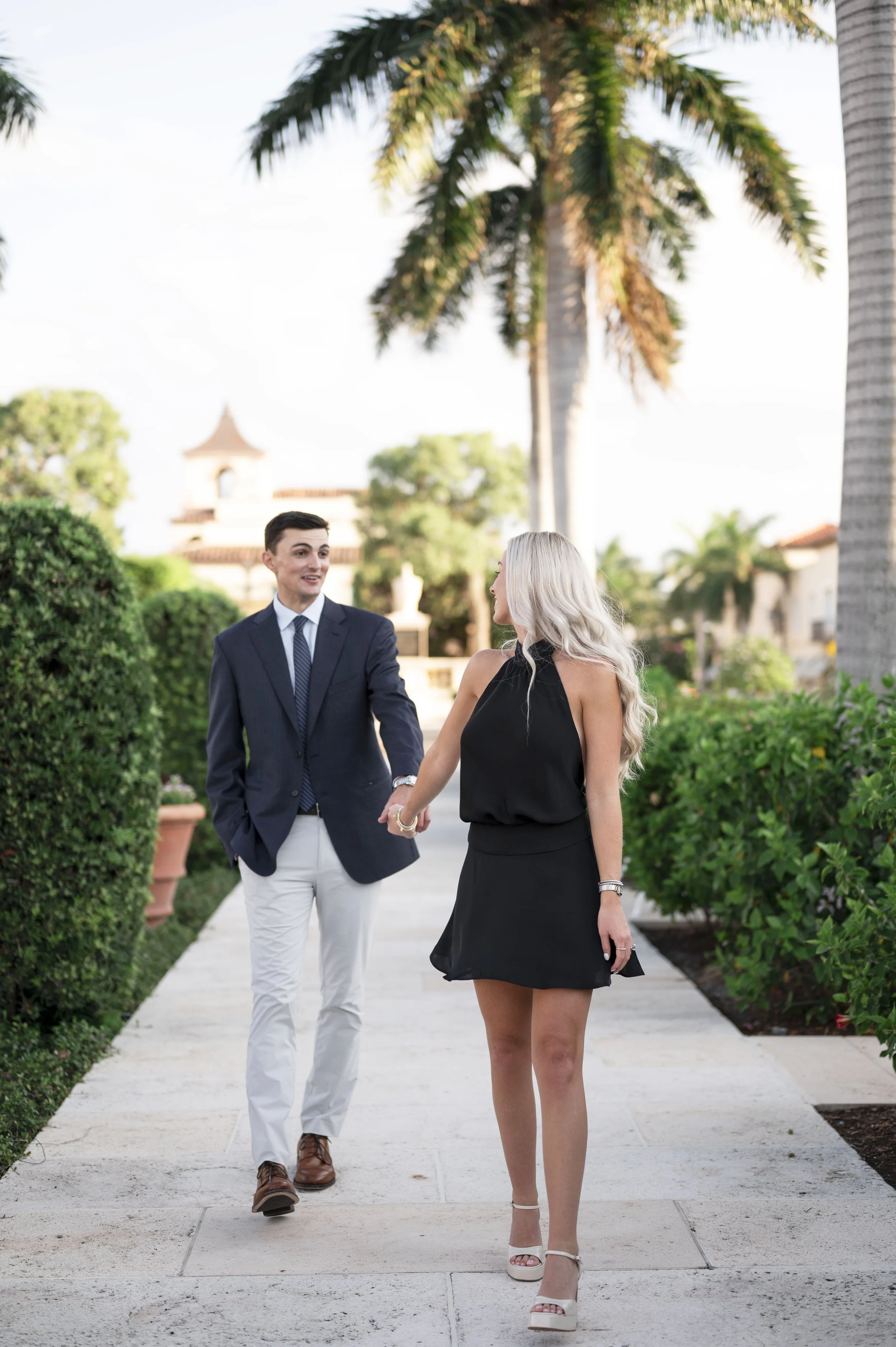 Engaged couple walking through Palm Beach after their surprise proposal (Copy)
