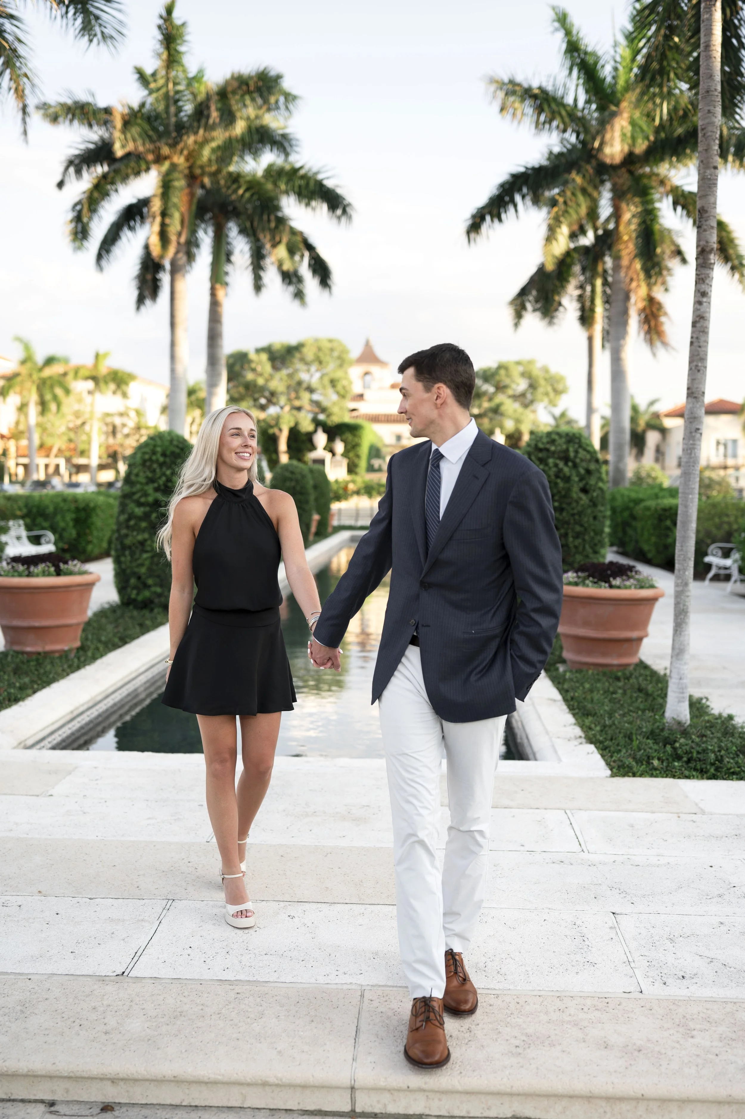 Engaged couple walking through Palm Beach after their surprise proposal (Copy)