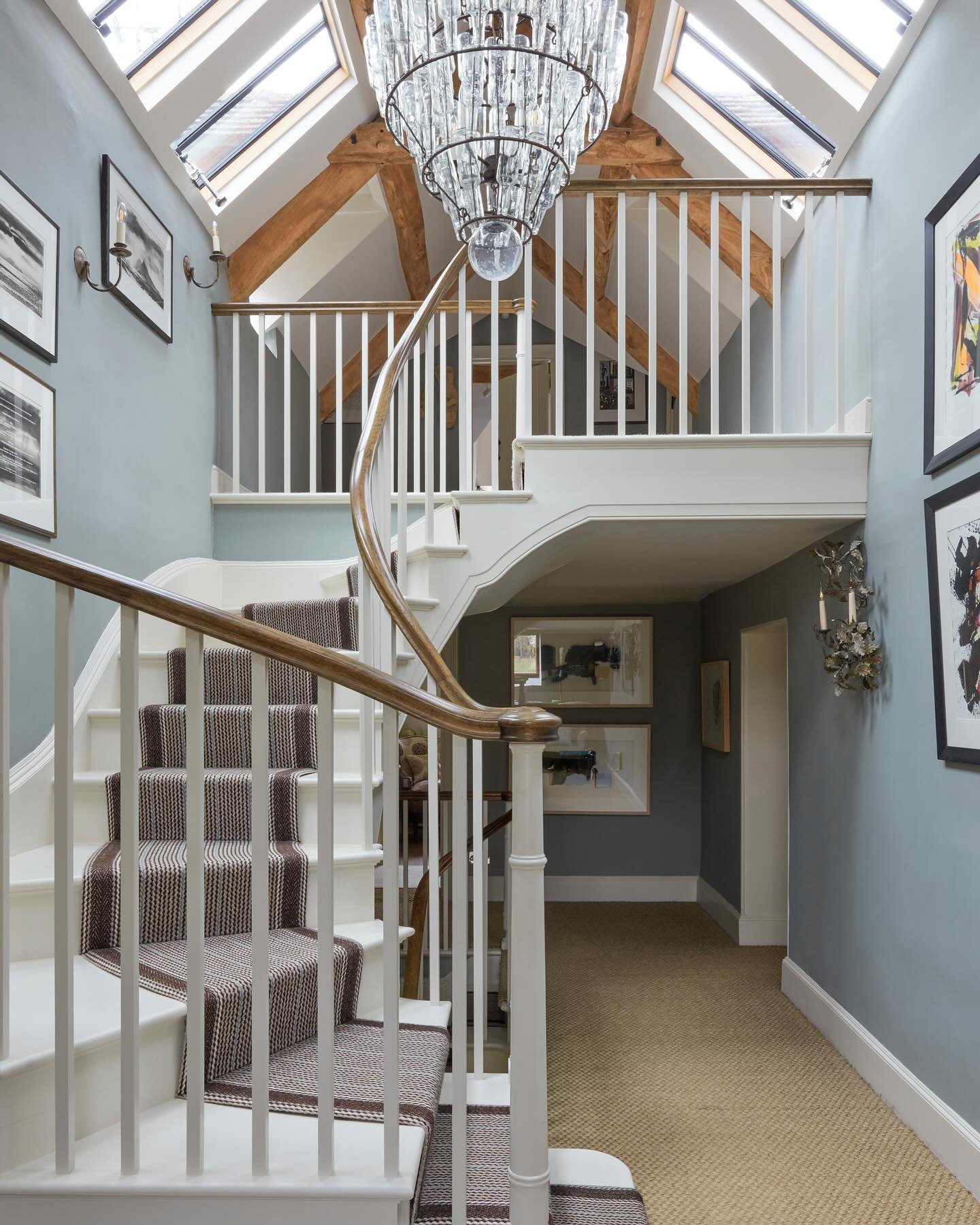 Let there be light. Adding conservation skylights and a new staircase transformed the upper floors in this Cotswolds farmhouse project - set off by a bottle chandelier. 📸 @james_mcdonald_photography #recentproject #farmhousechic #staircasedesign #co