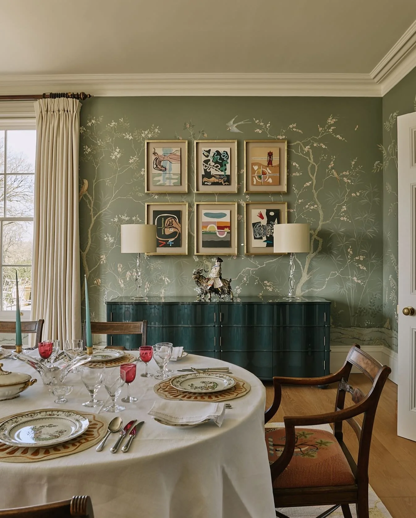 The art of juxtaposition. Rooms with some unexpected but still harmonious combinations are always more interesting. In the dining room of our Oxfordshire manor project the client&rsquo;s eighteenth century needlestitched chairs sit happily with a glo