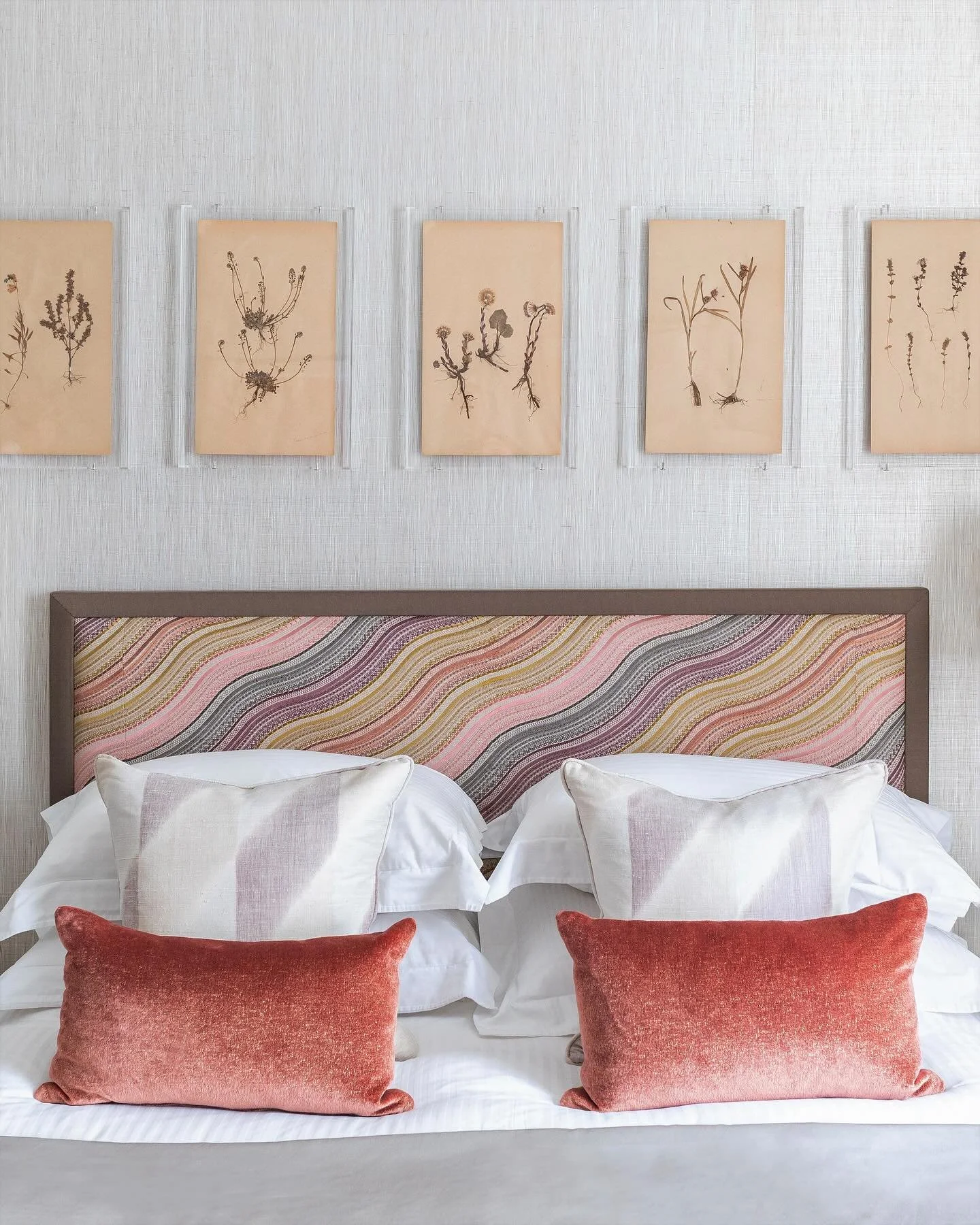 Making waves. An embroidered headboard and pressed flowers against grasscloth wallpaper from one of our London projects.  #londonhouses #interiordesign #bedroomdecor #howwedwell #modernhome #interiordesire #londonliving #interiorsaddict #headboarddes