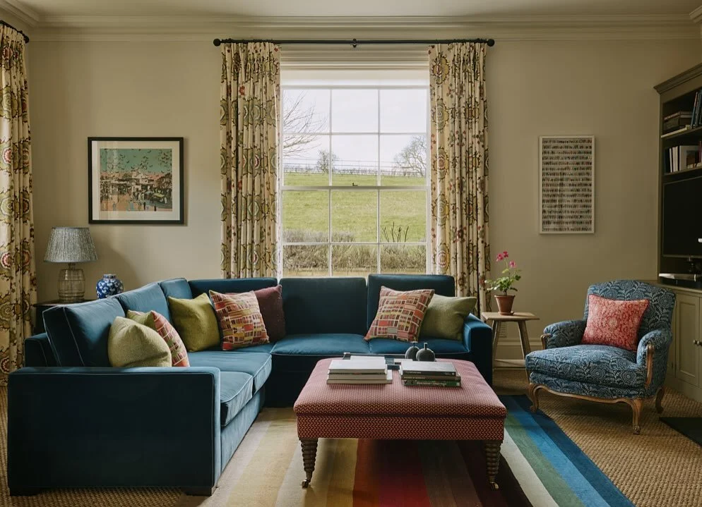 Colour coded. The sitting room in our Oxfordshire manor house project faced north but was brought to life by @ptolemymann.art&rsquo;s bold colourful flatweave from @christopherfarrdesign. 📸 @horwoodphoto #interiordesign #sittingroomdecor #flatweave 