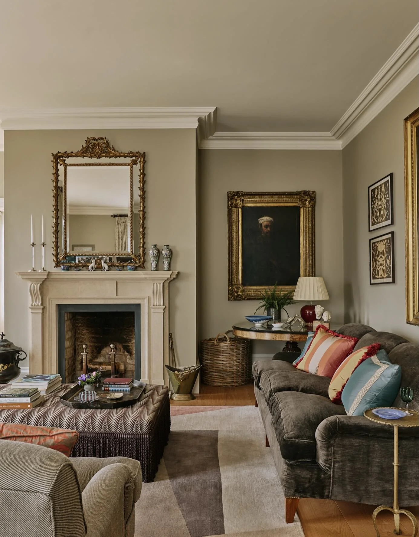 Drawing room drama. The formality of an Old Master painting and ornate gilt mirror is undercut by a  contemporary rug and @neishacrosland geometric fabric in our Oxfordshire manor house project. #interiordesign #countryhousestyle #howwedwell #sitting