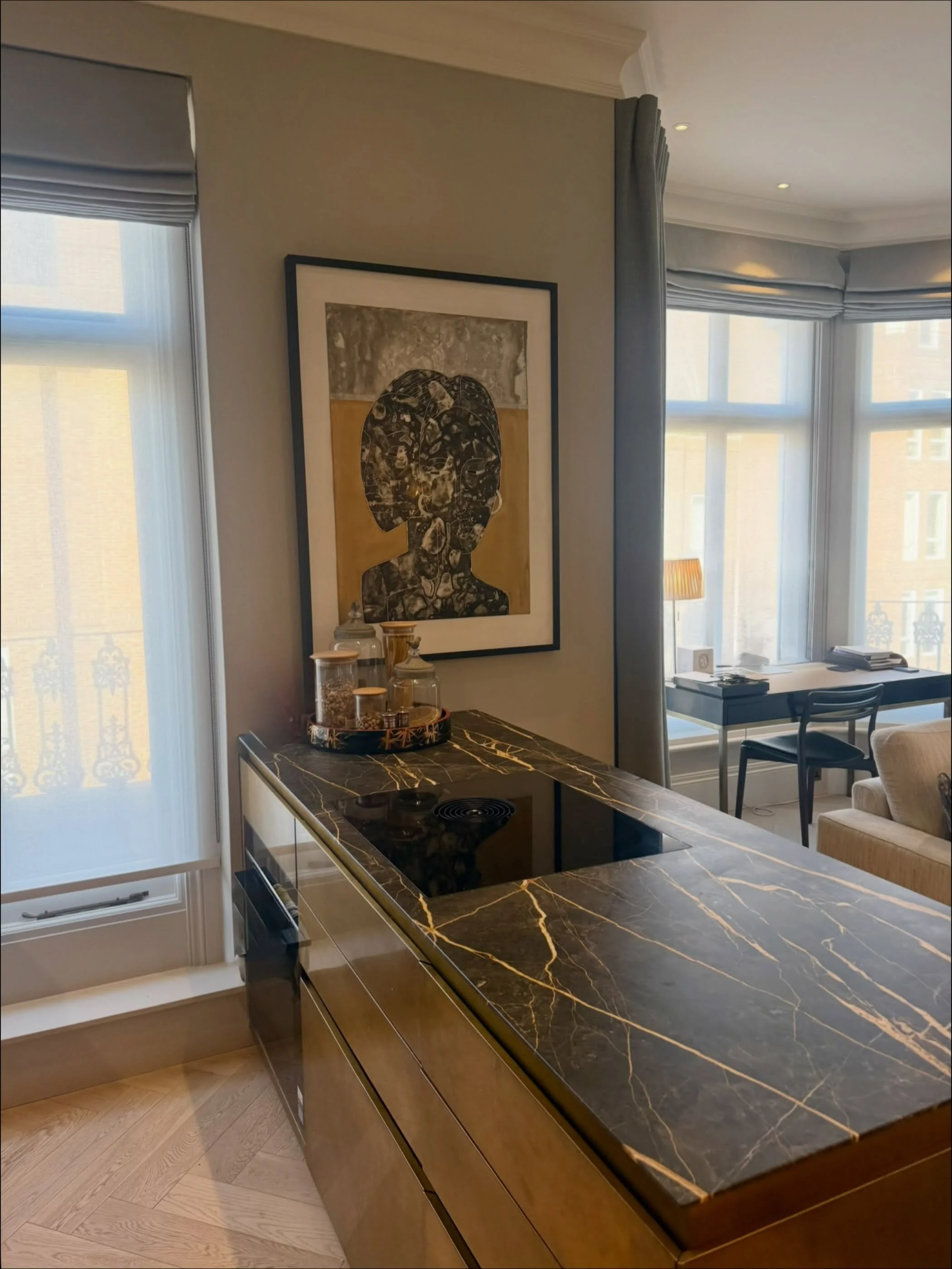 City sleek. A quick glimpse of our Chelsea garden square project: the kitchen is designed to blend into the living space with a peninsula in aged brass and veined marble. #interiordesign #londonliving #howwedwell #kitchendesign #naturalstone