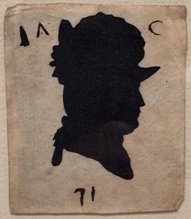 Silhouette of profile of colonial soldier wearing hat