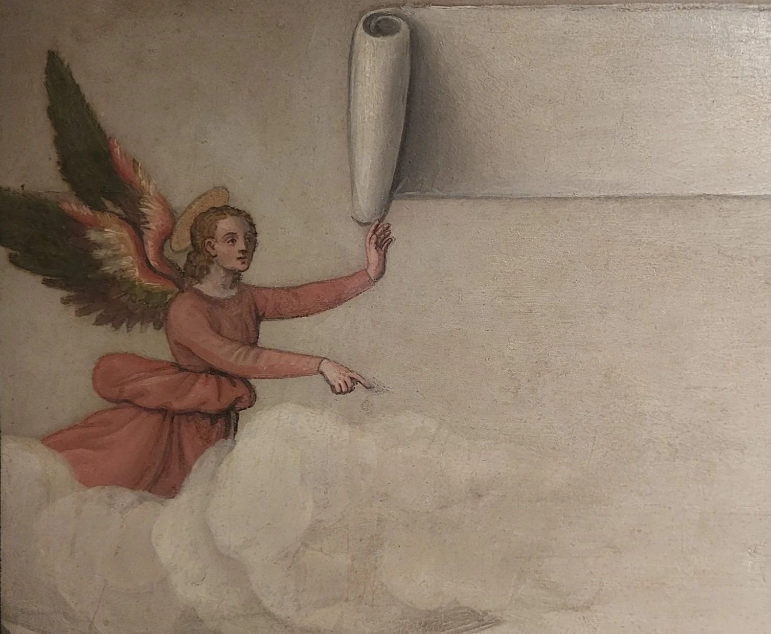 Winged angel in profile wearing red robe above clouds holds a scroll and points downward