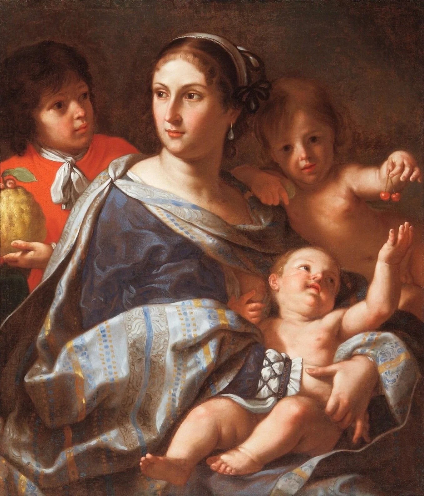 A woman with an infant in her lap.