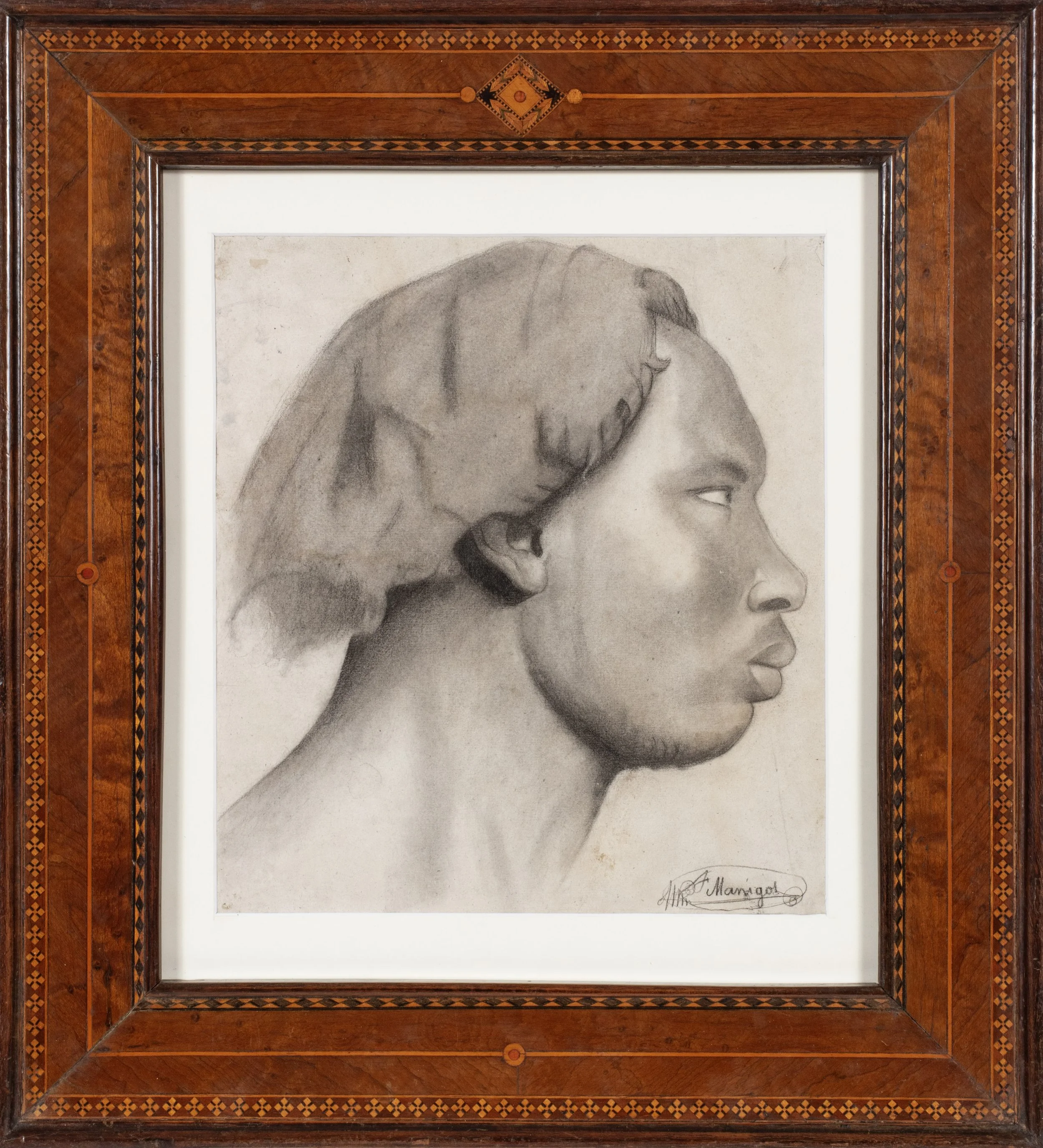 Black man seen in profile facing to the right.