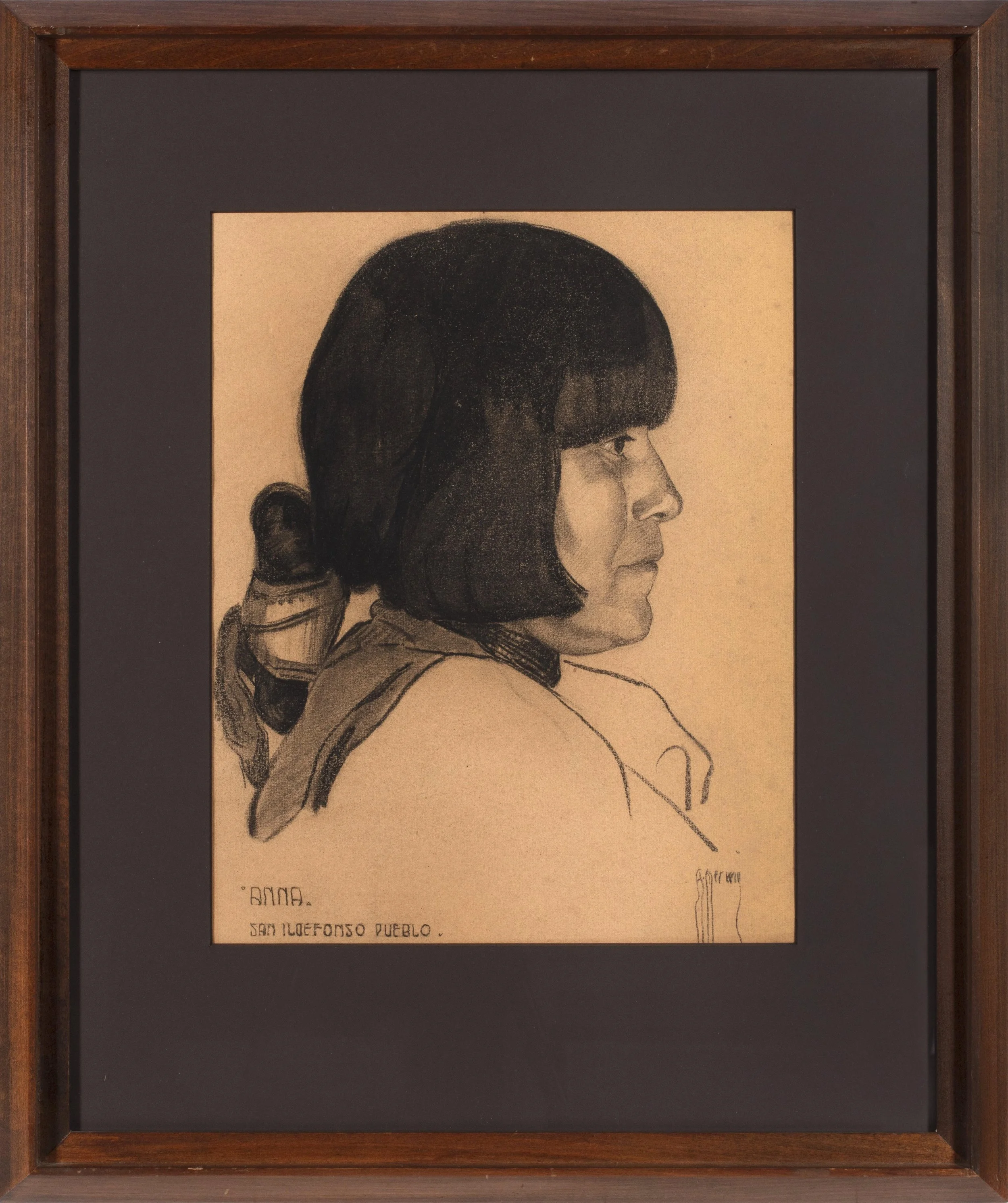 Profile of a woman with short hair.