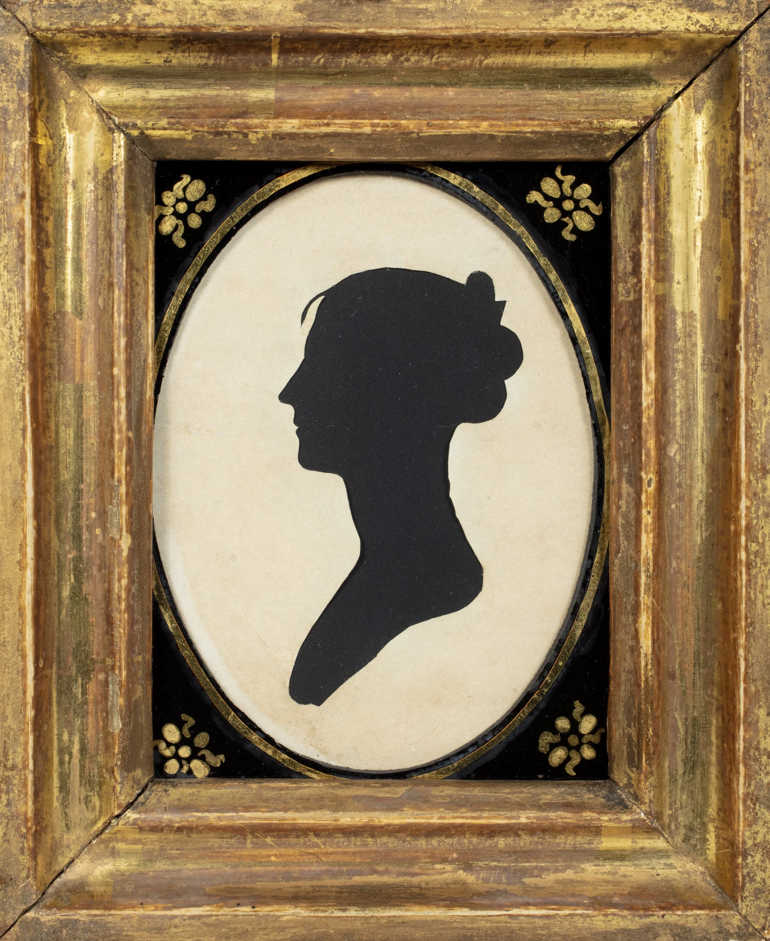 Bust of a woman in profile looking to the left.