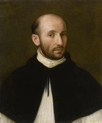 Bald man facing right wearing a white robe with a black cape.