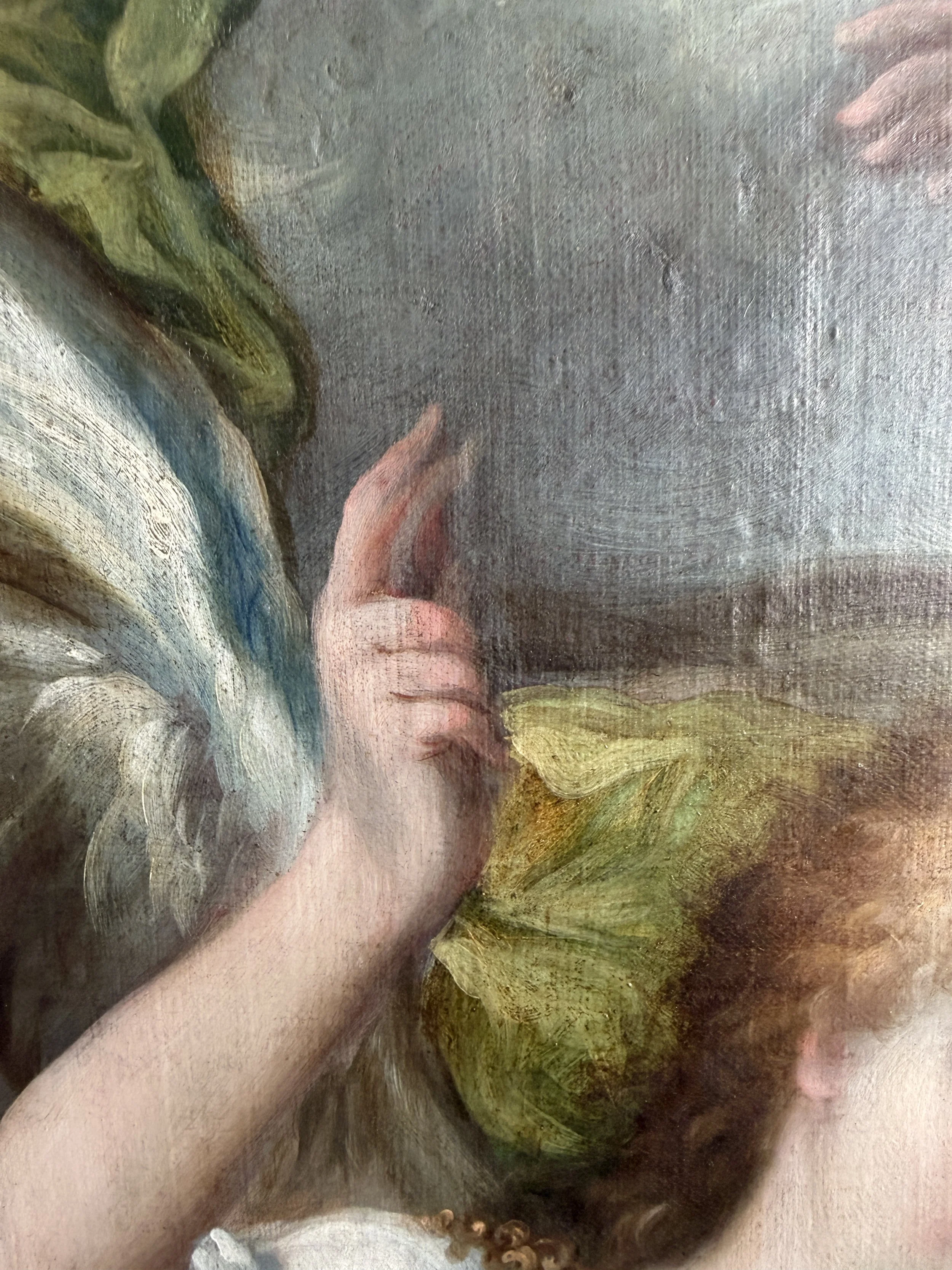 Close-up detail of angel's hand revealing pentimento beneath painted surface