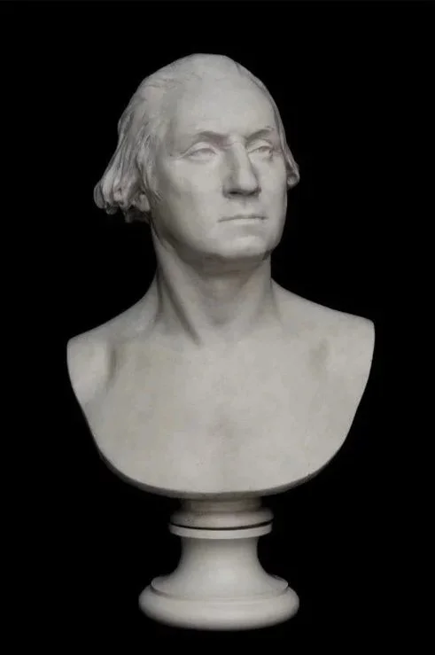 Bust of a man on a white base.