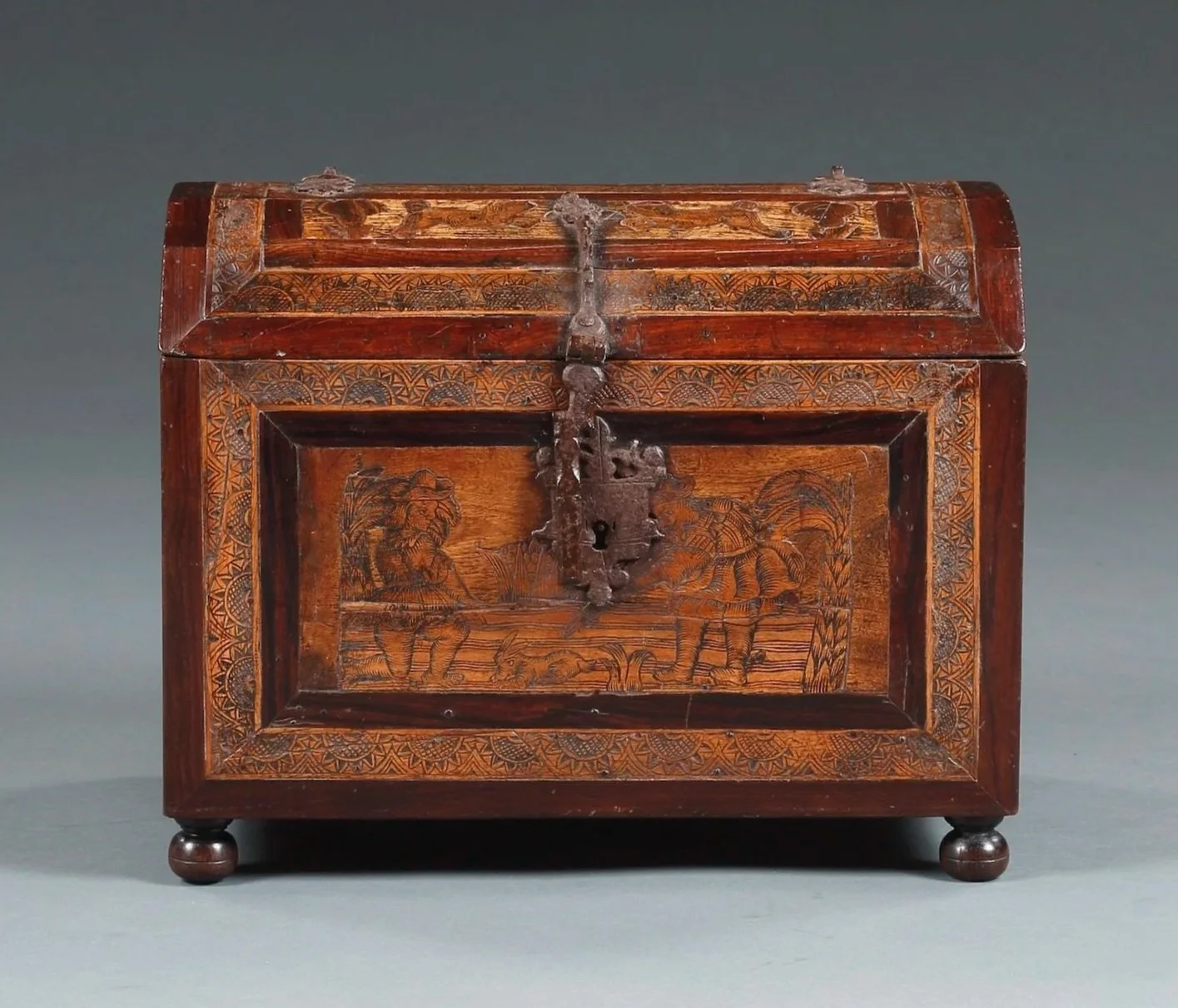 Inlaid and engraved coffer with images of figures and animals