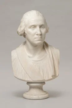 Small sculpture of a bust of a man.