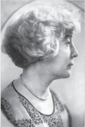 Profile of woman with short hair and wearing pearl necklace