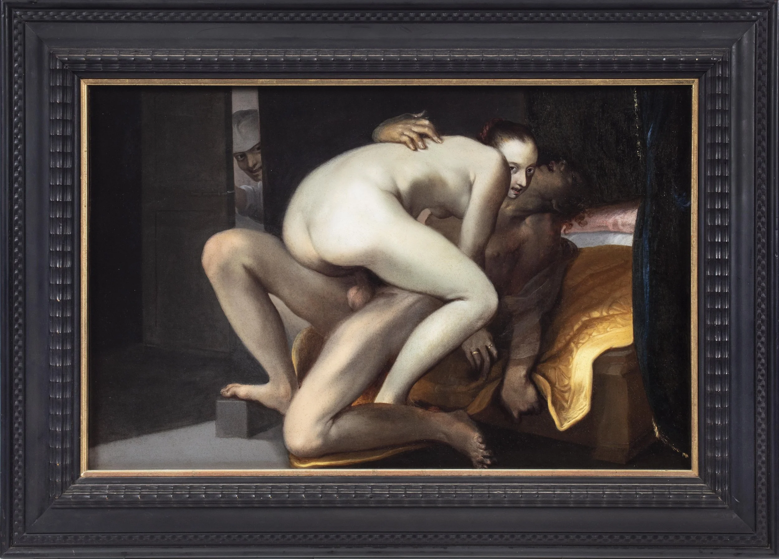 Two lovers in the bedroom while a third figure looks on from an open door.