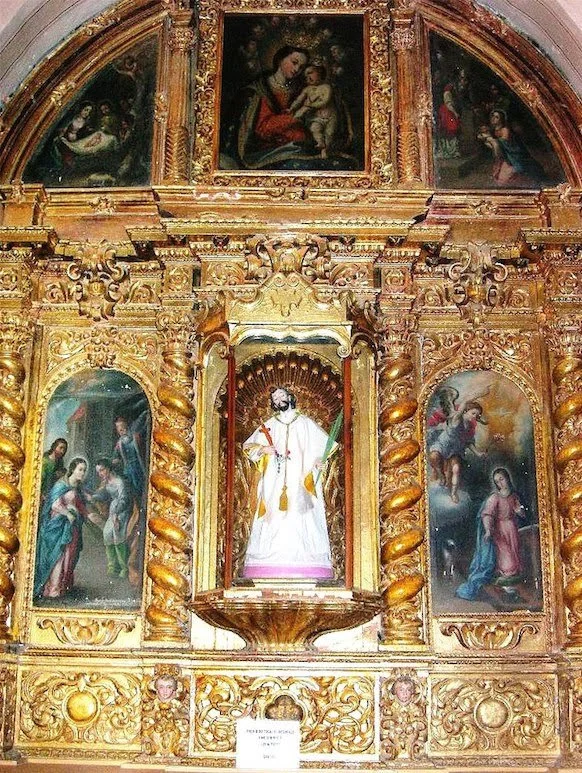Ornate golden church altarpieces of biblical scenes with central figure of St. John Nepomuk