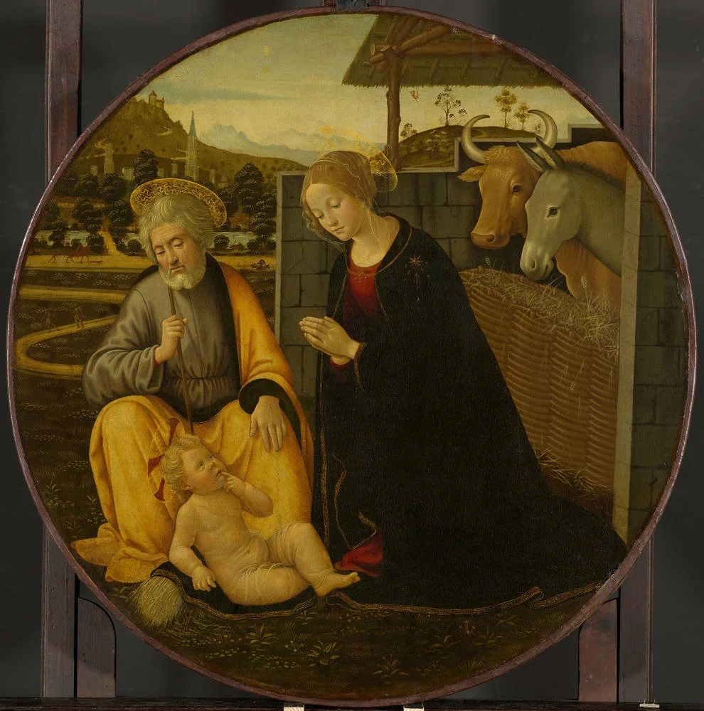 Mary and Joseph adoring the infant Christ beside ox and donkey