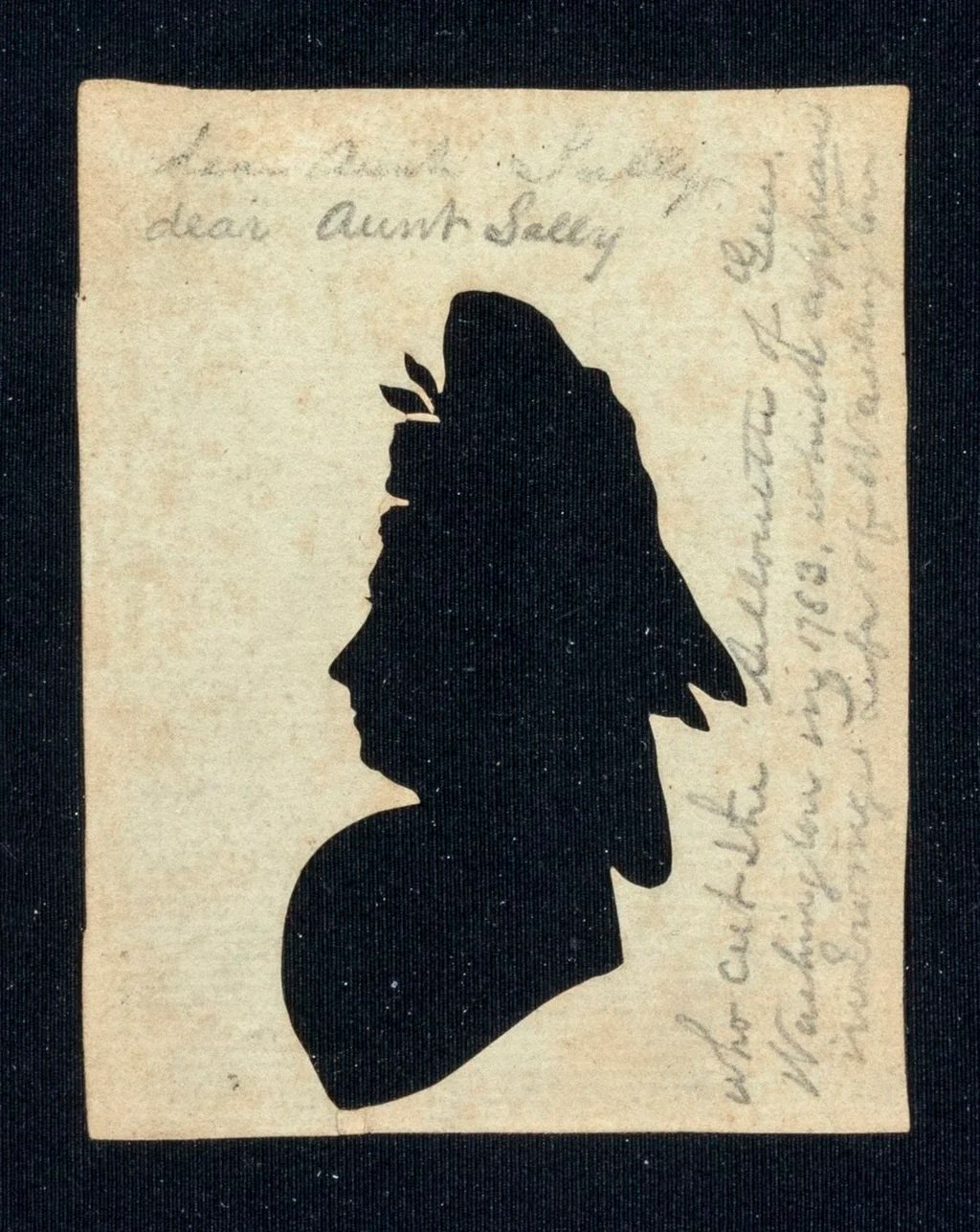 Silhouette of female profile on paper with hand writing