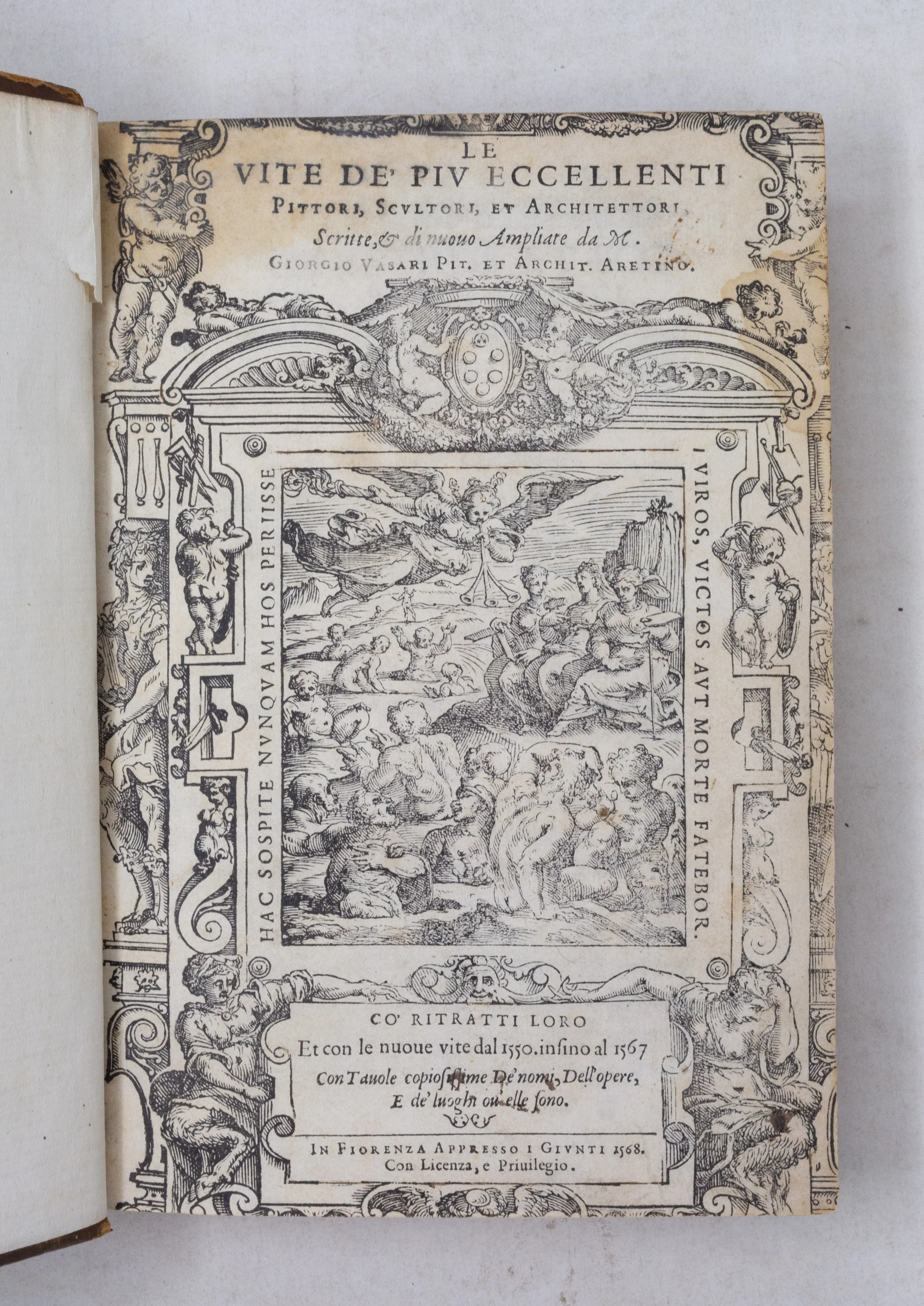Ornate title page of Vasari's Lives framed by architectural decorations with Medici coat of arms and densely figured engravings