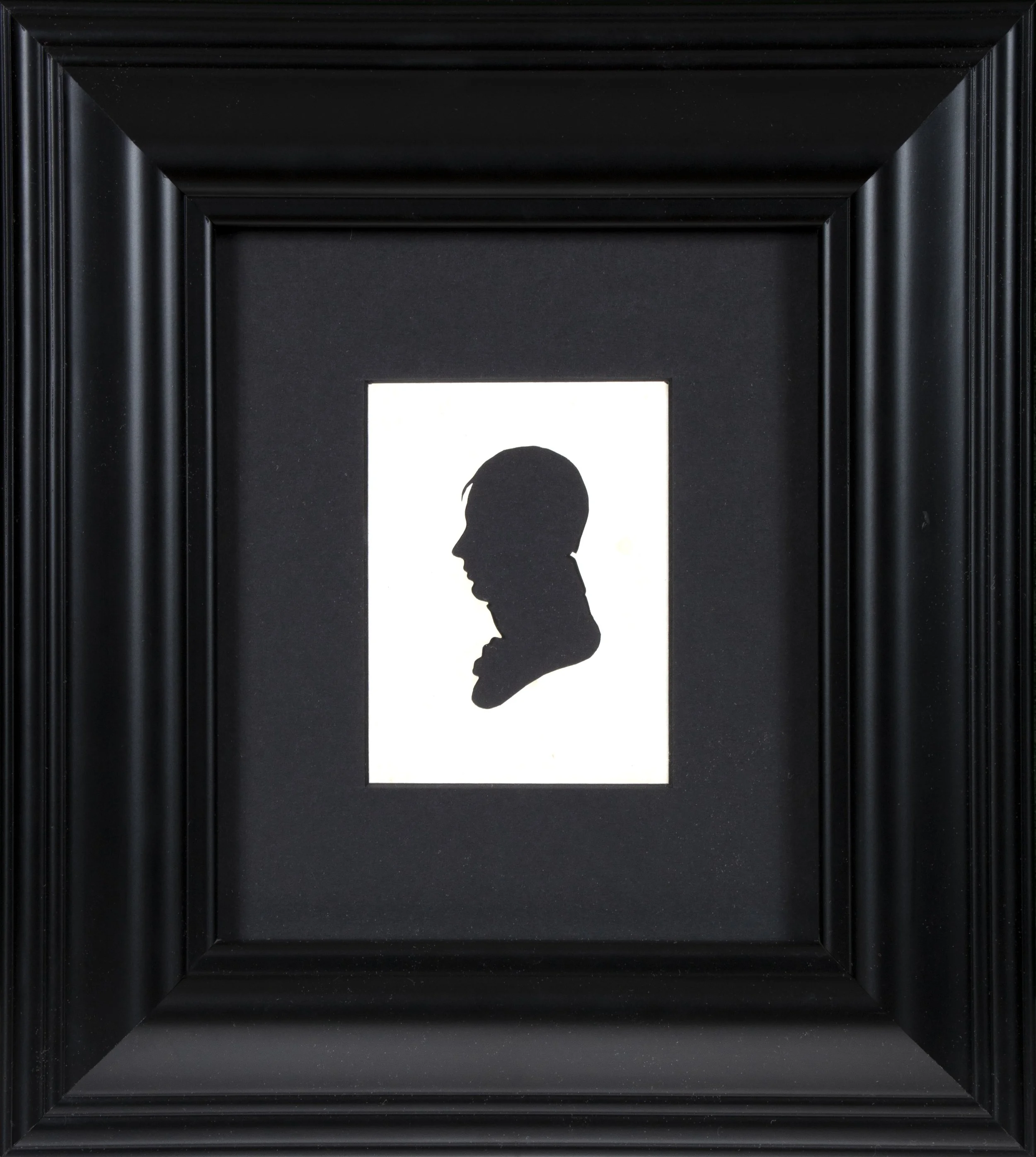 Bust of a man in profile looking to the left.