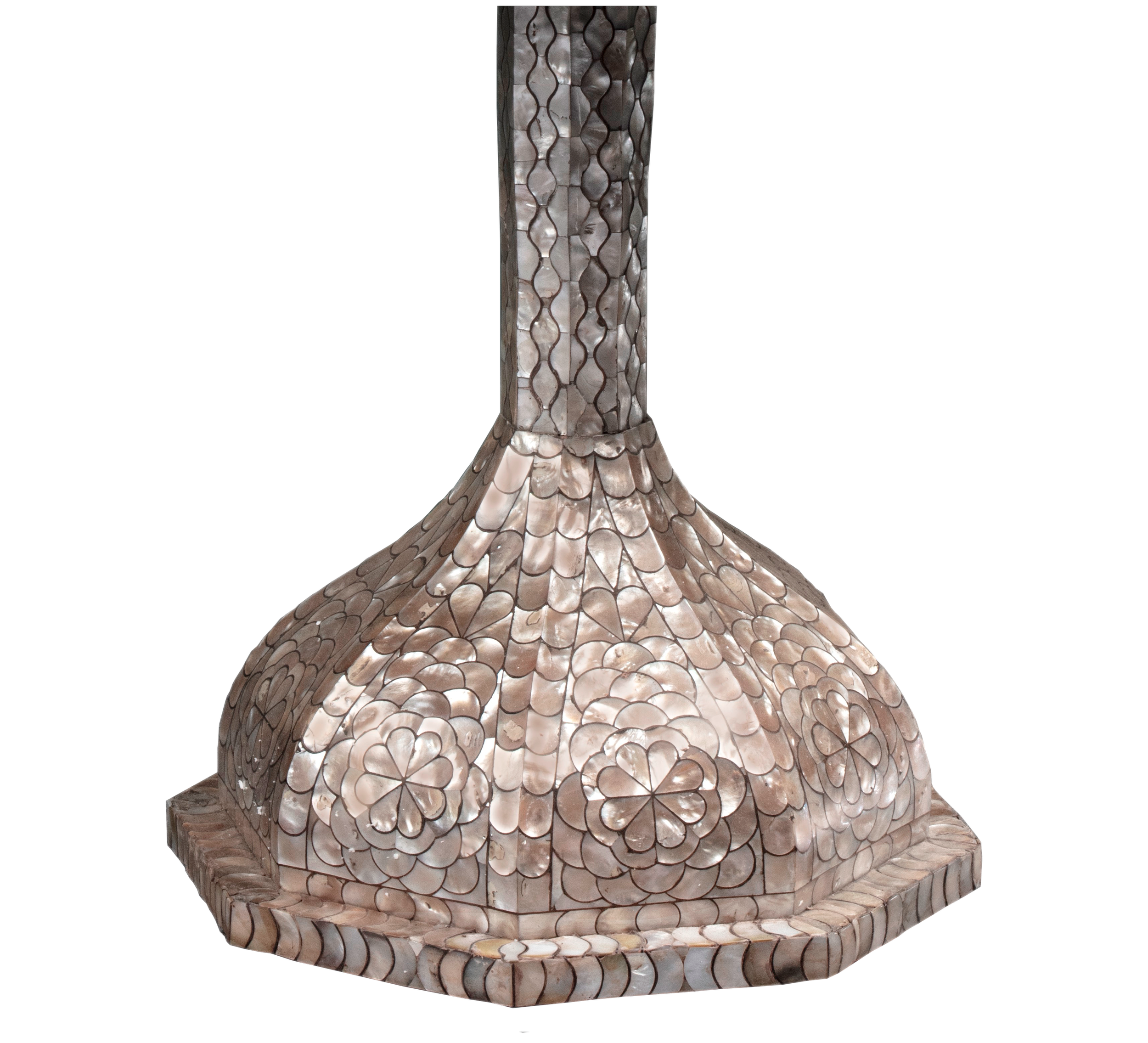 Central table leg that leads to a bulbous foot. Both covered in mother of pearl inlay.