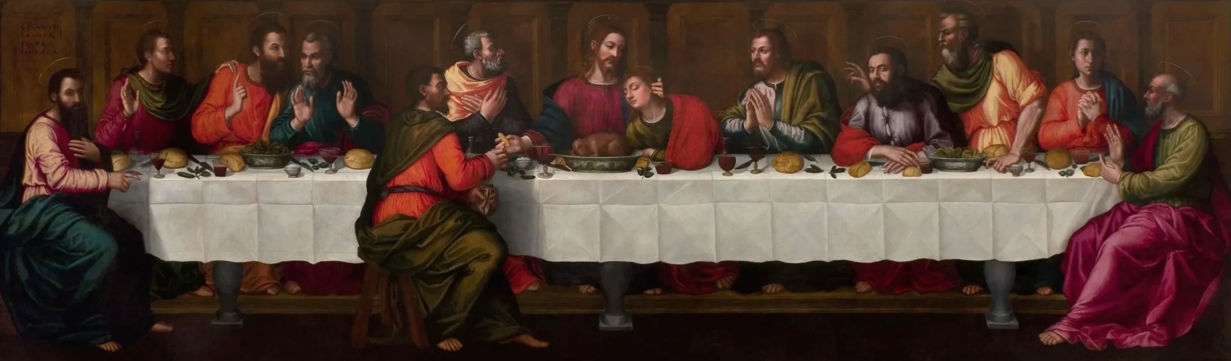 Twelve men seated along a wide table.