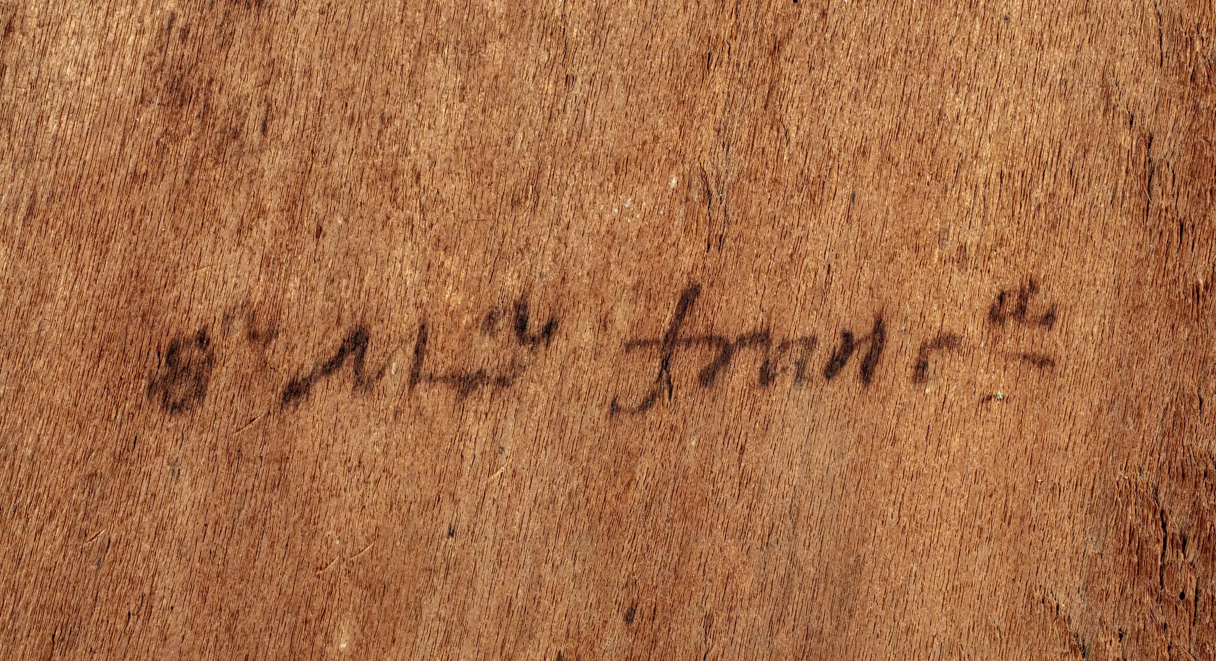 Black inscription of name of possible original owner