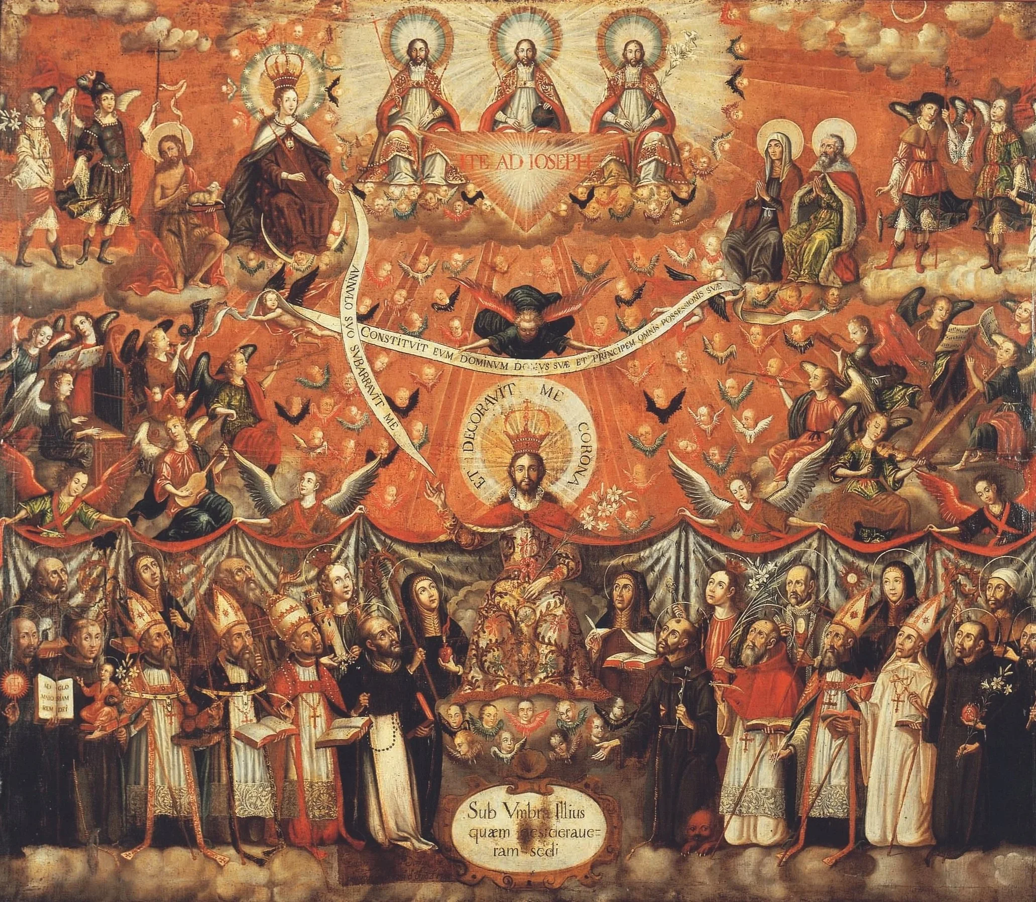 Joseph sits in the middle flanked by saints under his mantle and Virgin Mary, four archangels, the Holy Trinity, Mary's parents, John the Baptist, and angels appear above in the sky