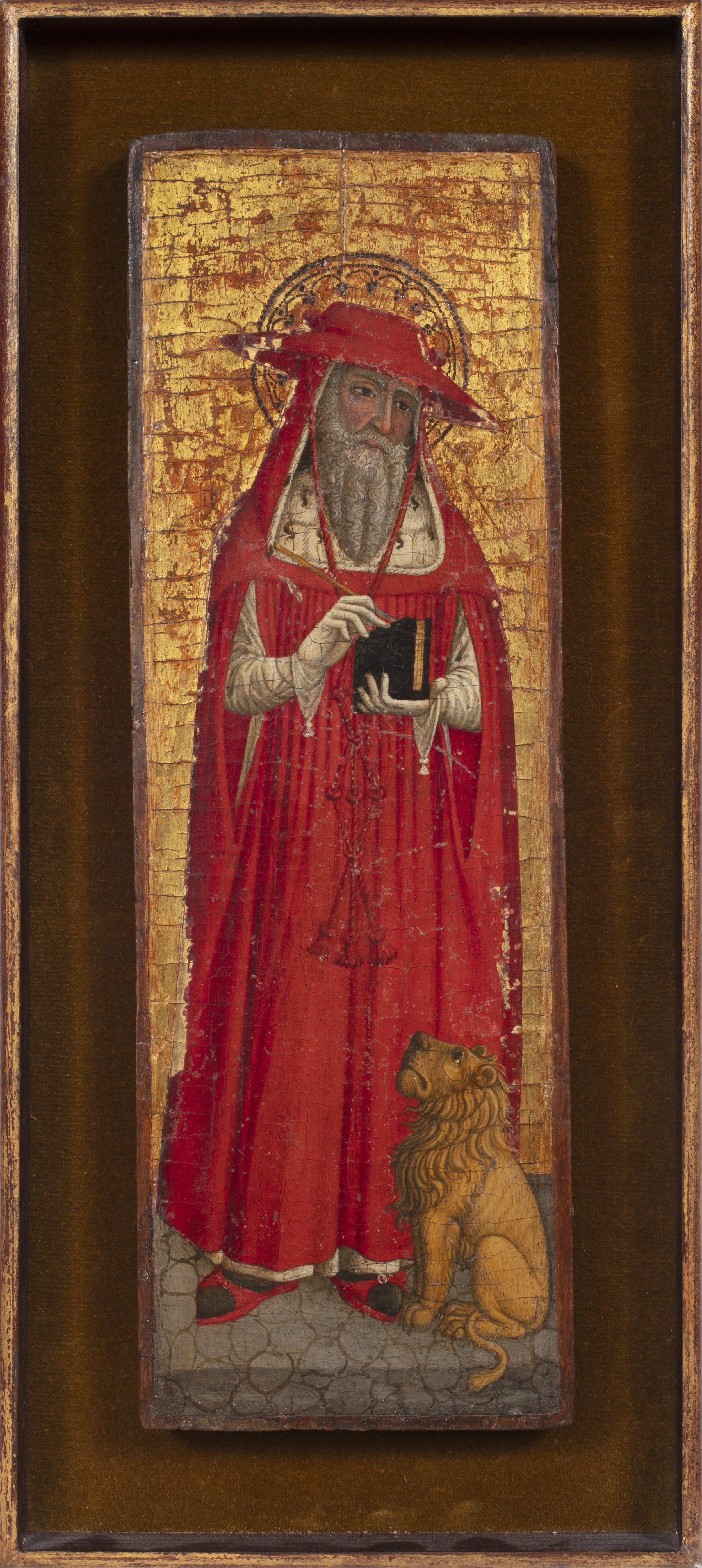 Cardinal saint dressed in red robes holding a book with a lion at his feet.