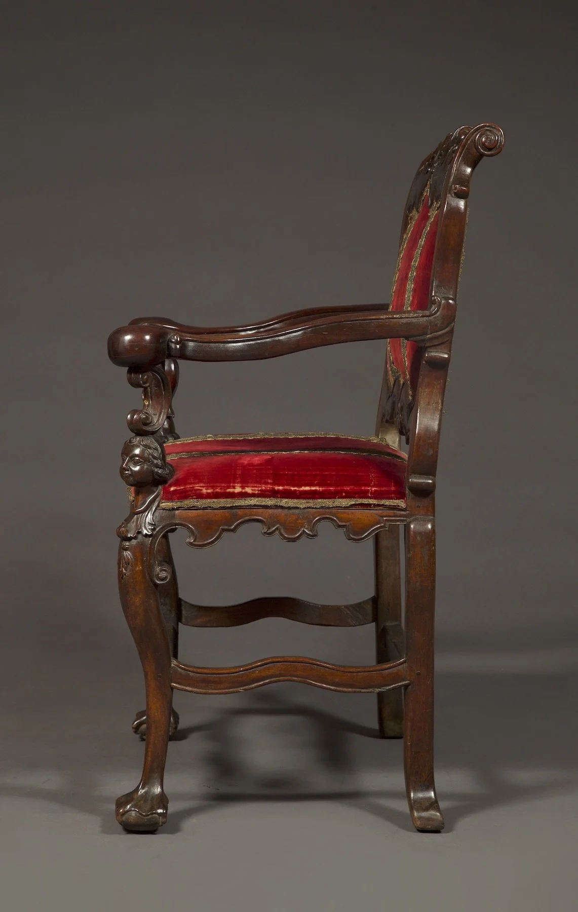 Side view of the red velvet chair
