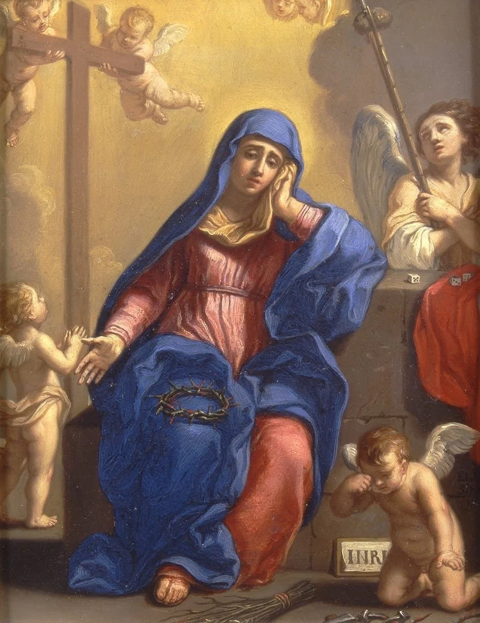 Virgin in blue and red robes, seated, looking forlorn.