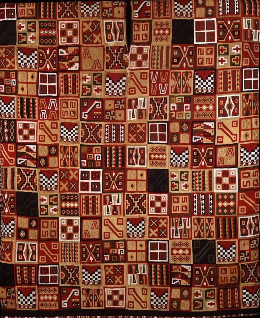 Incan tunic with geometric patterned squares in red, black, and gold